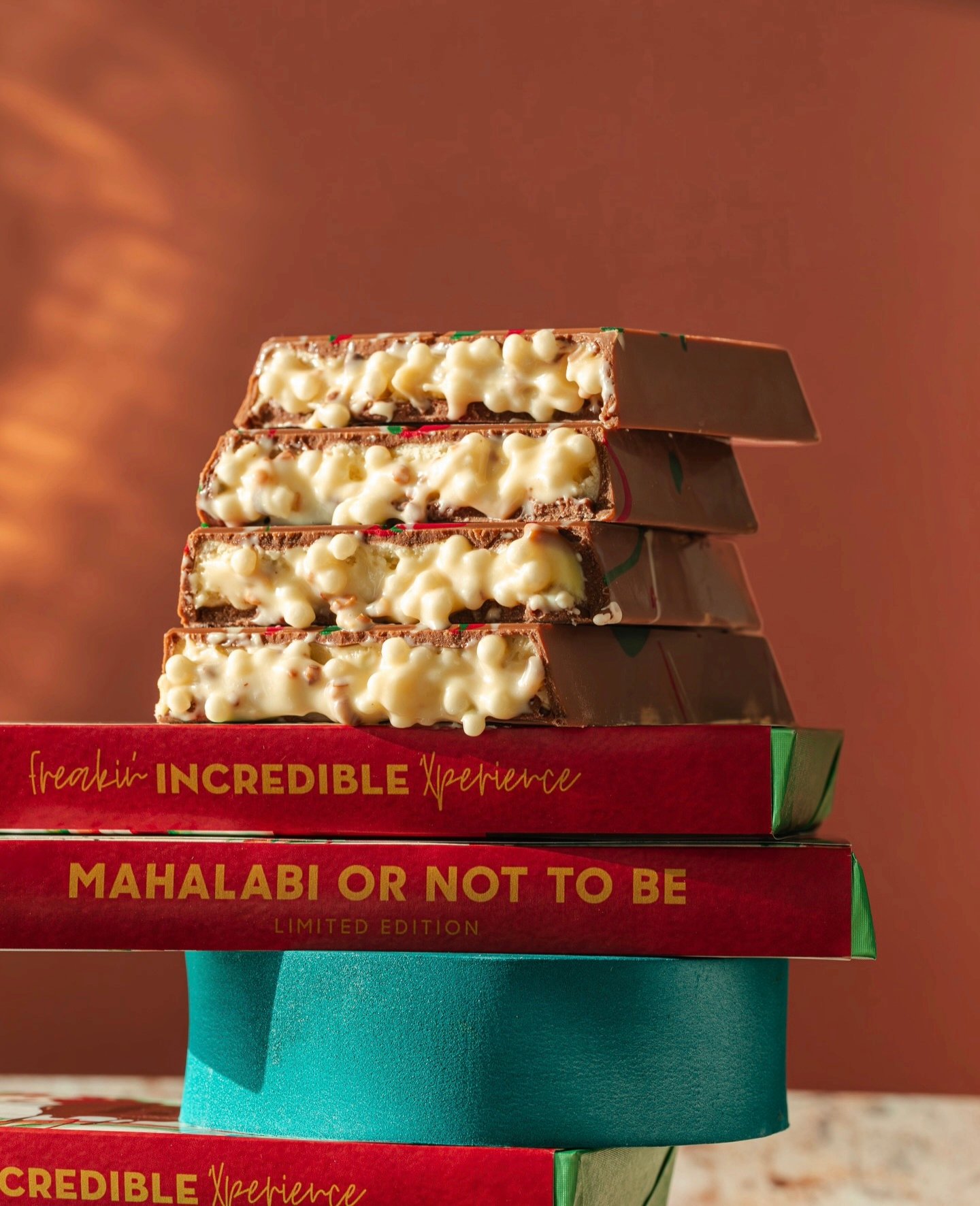 Close up of homemade chocolate brownie topped with crunchy roasted peanuts, shiny crust and fudgy texture, delicious nutty dessert for sweet lovers.