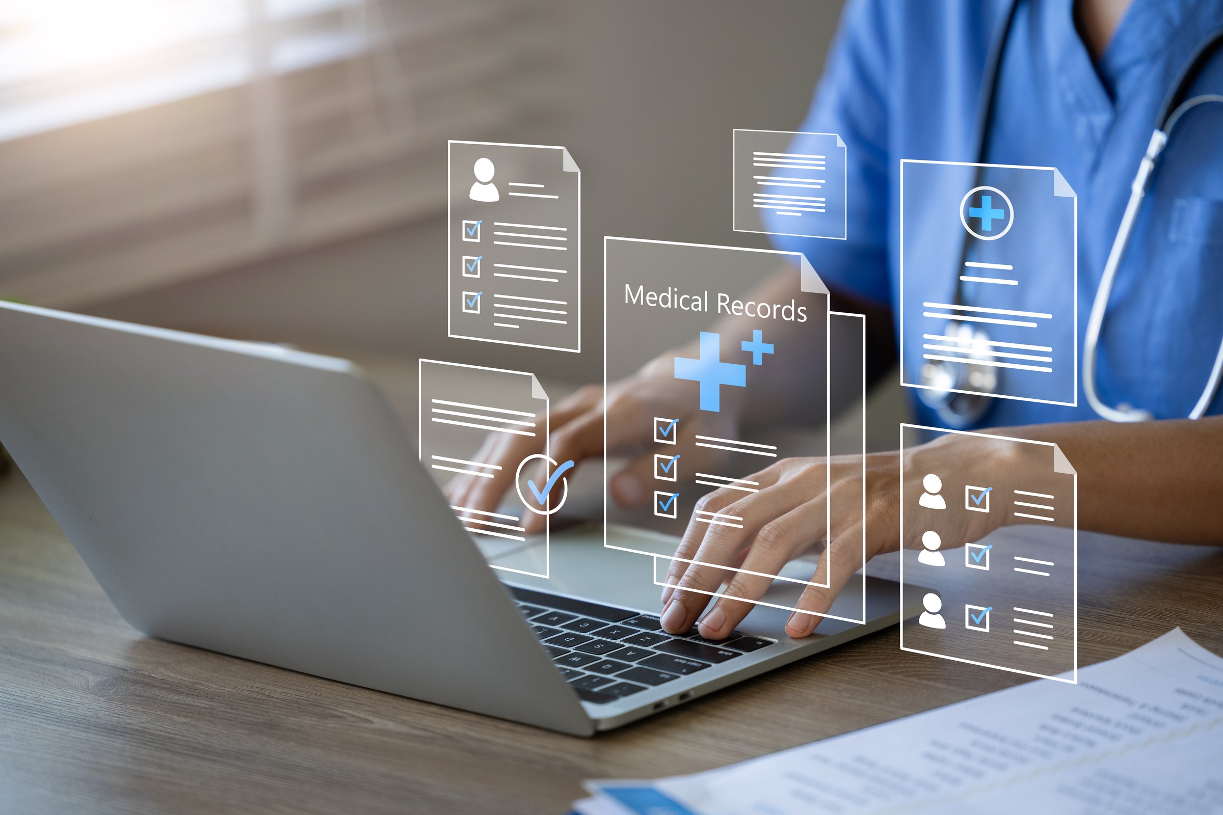 Doctor using laptop to manage electronic medical records,modern digital health information systems and data security.