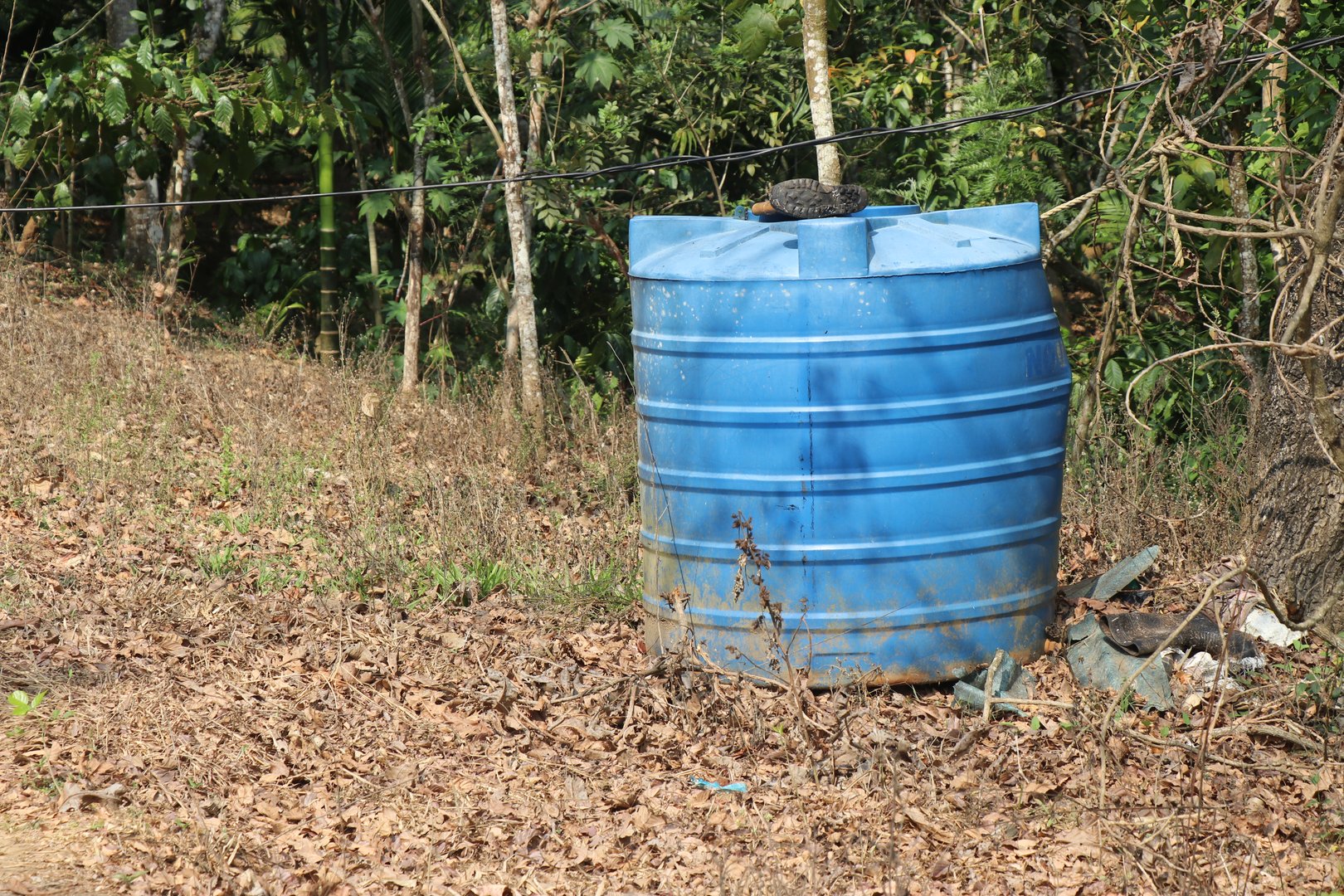 Abandoned water tank made of plastic used to provide water for agriculture. Big size water container