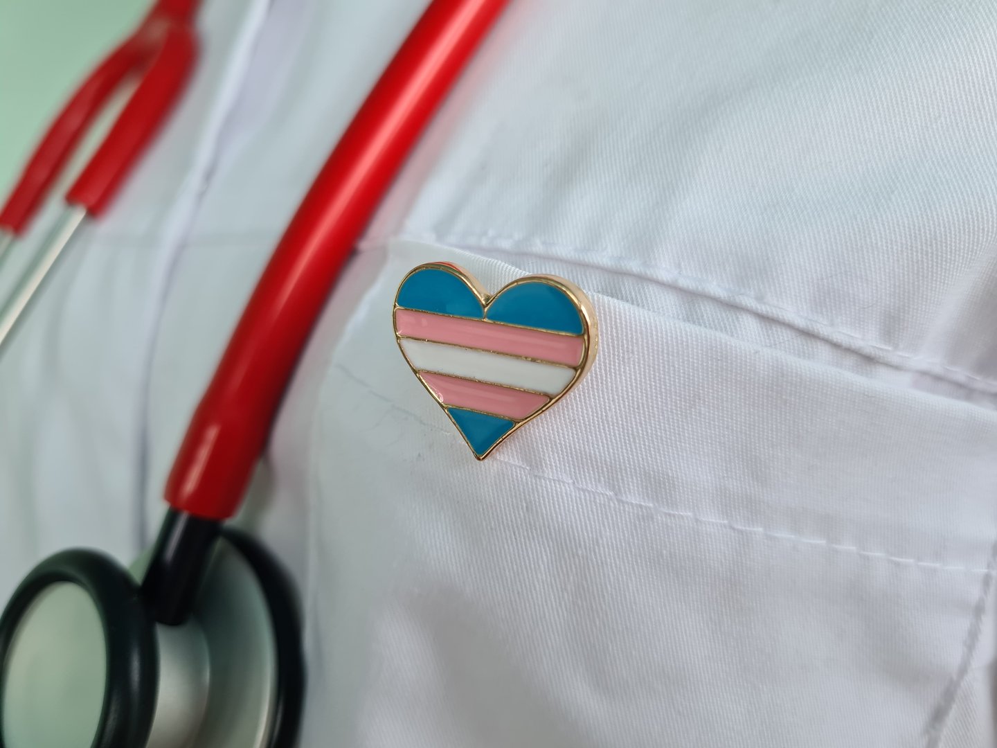 Transgender LGBT symbol stethoscope with rainbow icon for rights and gender equality. Medical care insurance and doctor