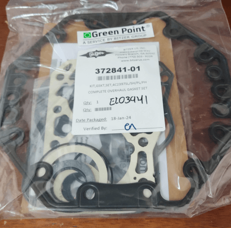 Bitzer gasket set in a sealed package with product label and part number 372841-01, placed on a wooden surface.