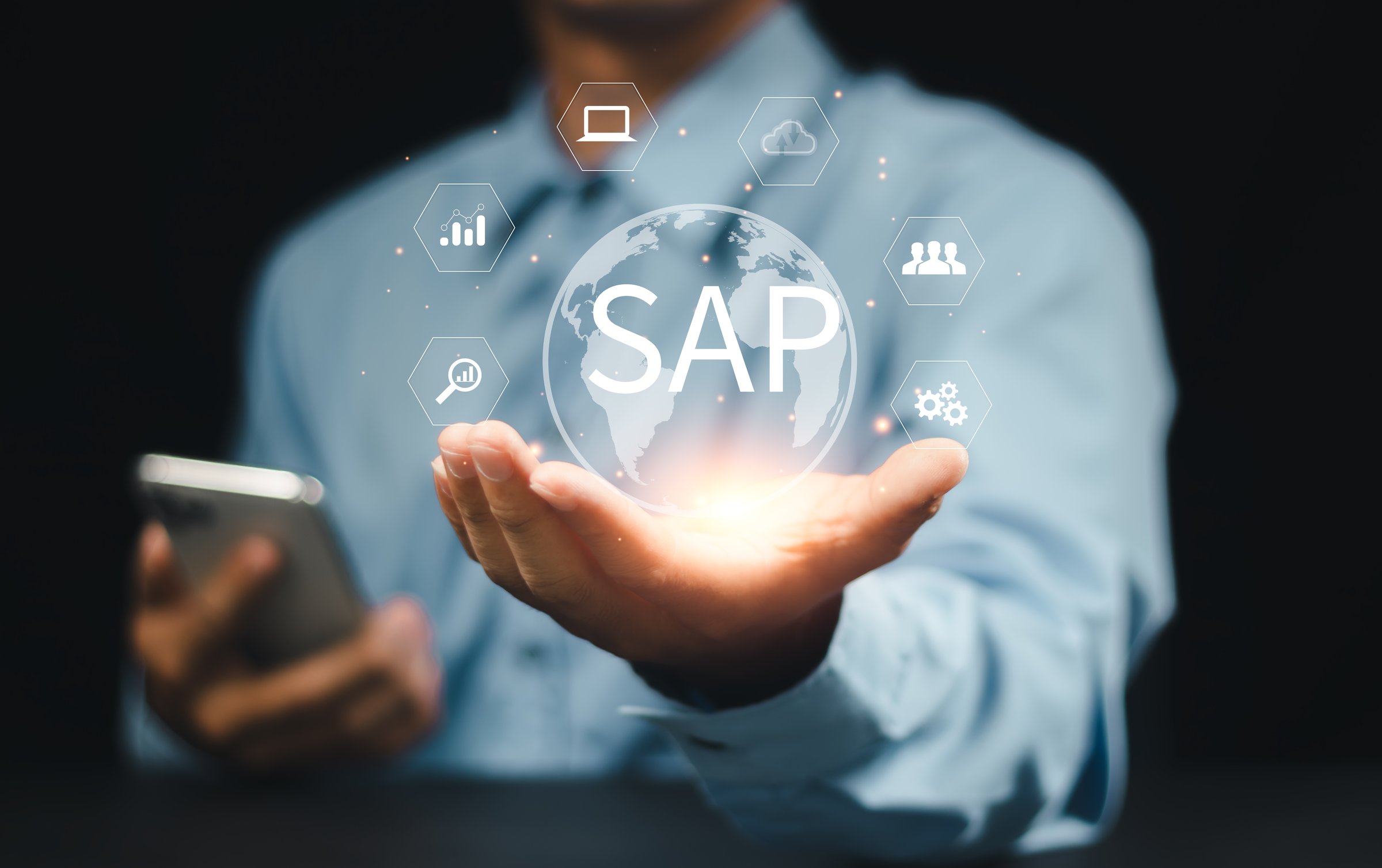 SAP or ERP enterprise resources planning system concept - Person hold virtual globe with SAP word for business process automation software and management software (SAP)