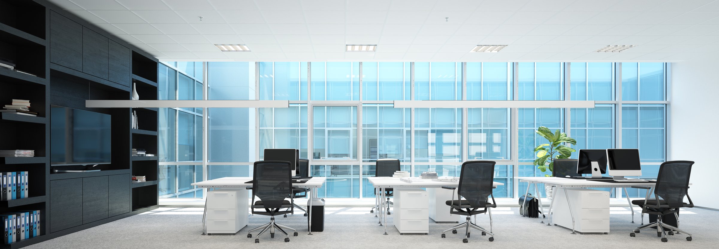 Modern office interior with empty desks chairs and computers in a spacious room. Contemporary workspace design for corporate business. 3d render
