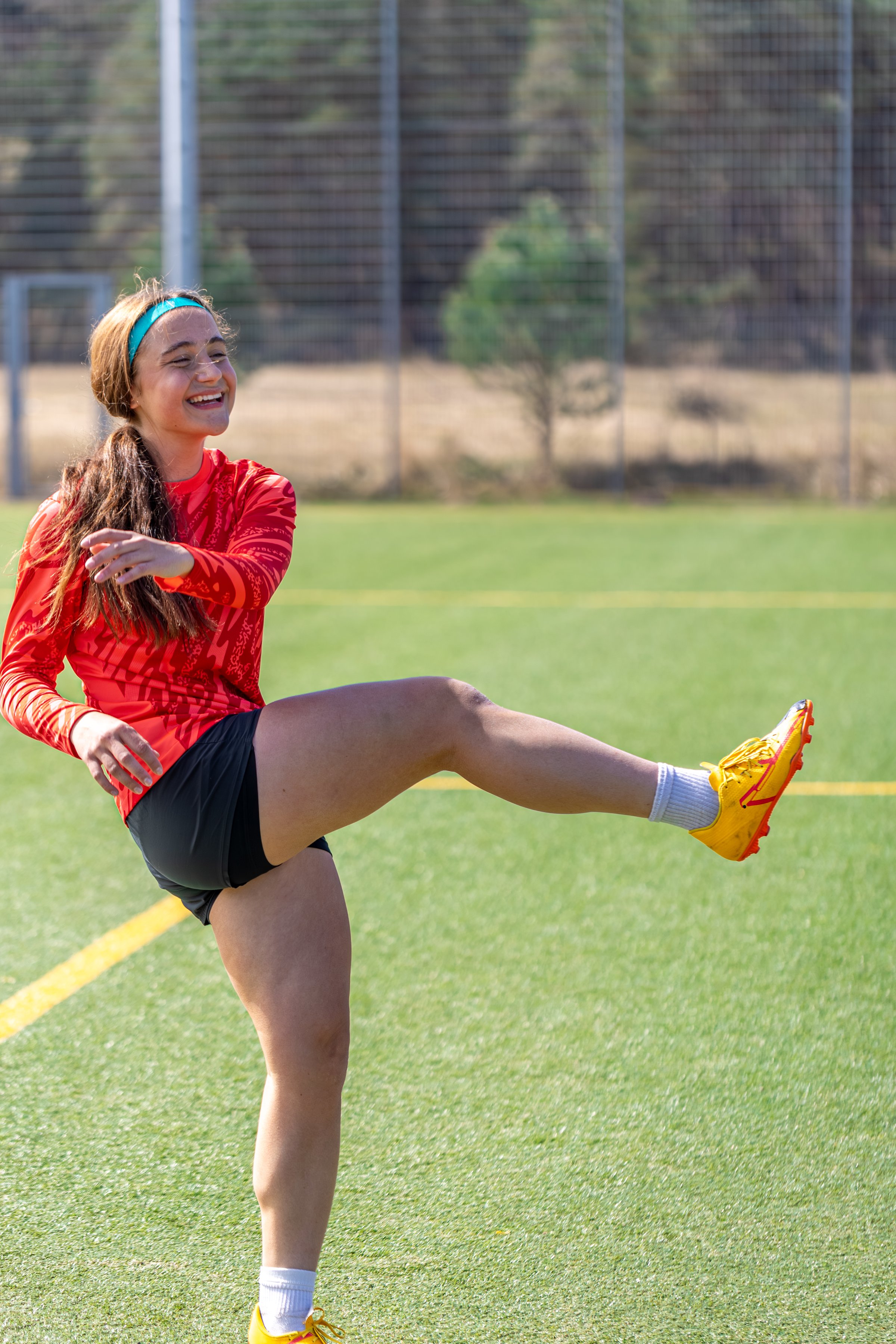 Girl soccer player. Girl in sports uniform on the soccer field. Football concept. High quality photo. Stadium. Football training. Active lifestyle. Sports concept.