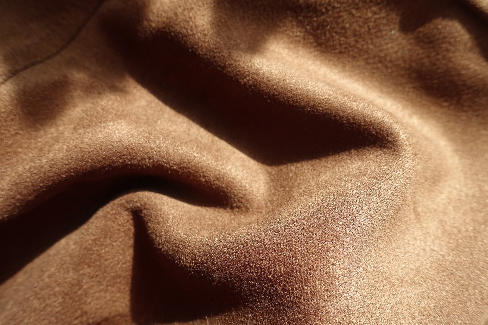 chocolate brown faux suede polyester fabric in soft folds