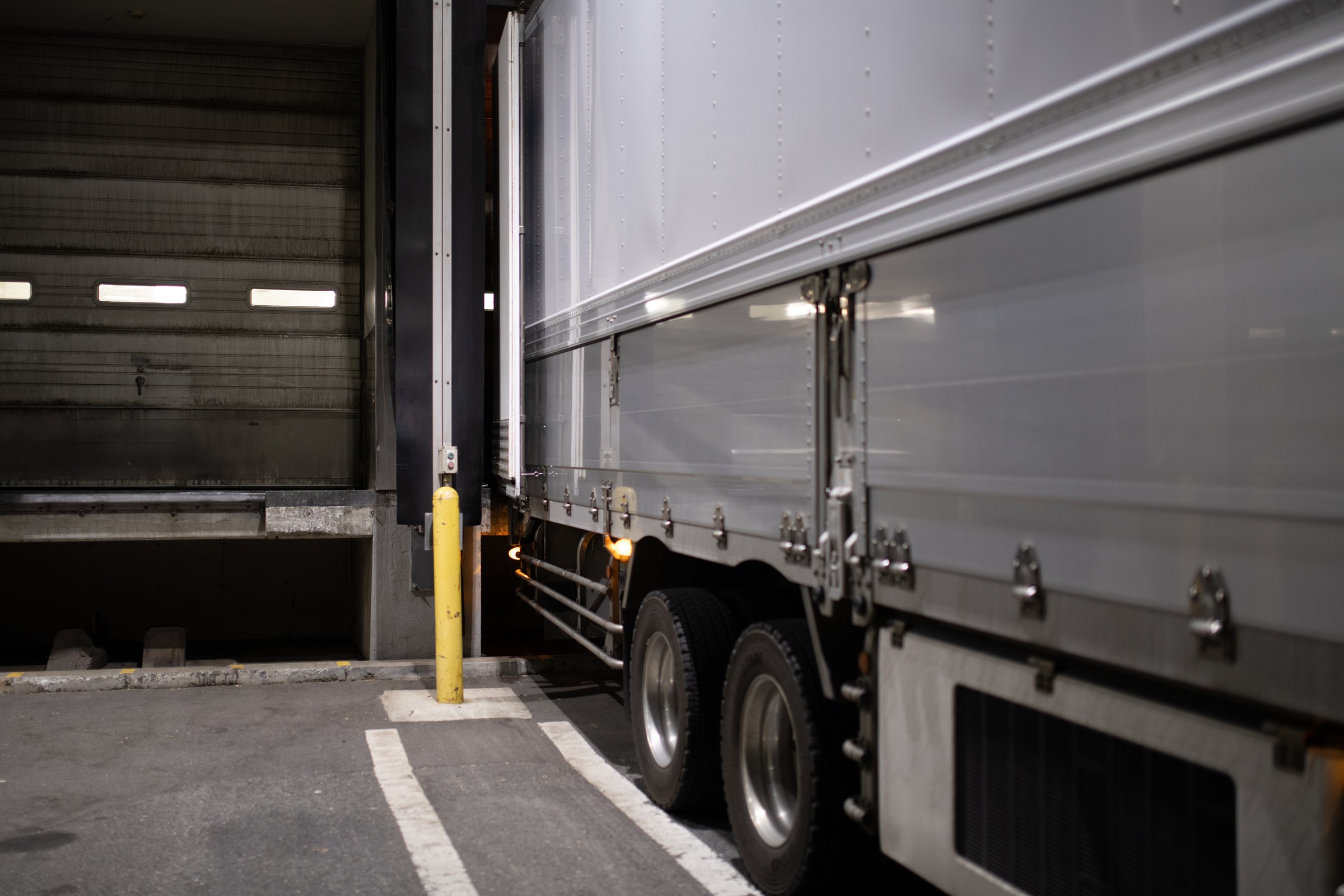 Large truck unloading at truck berth