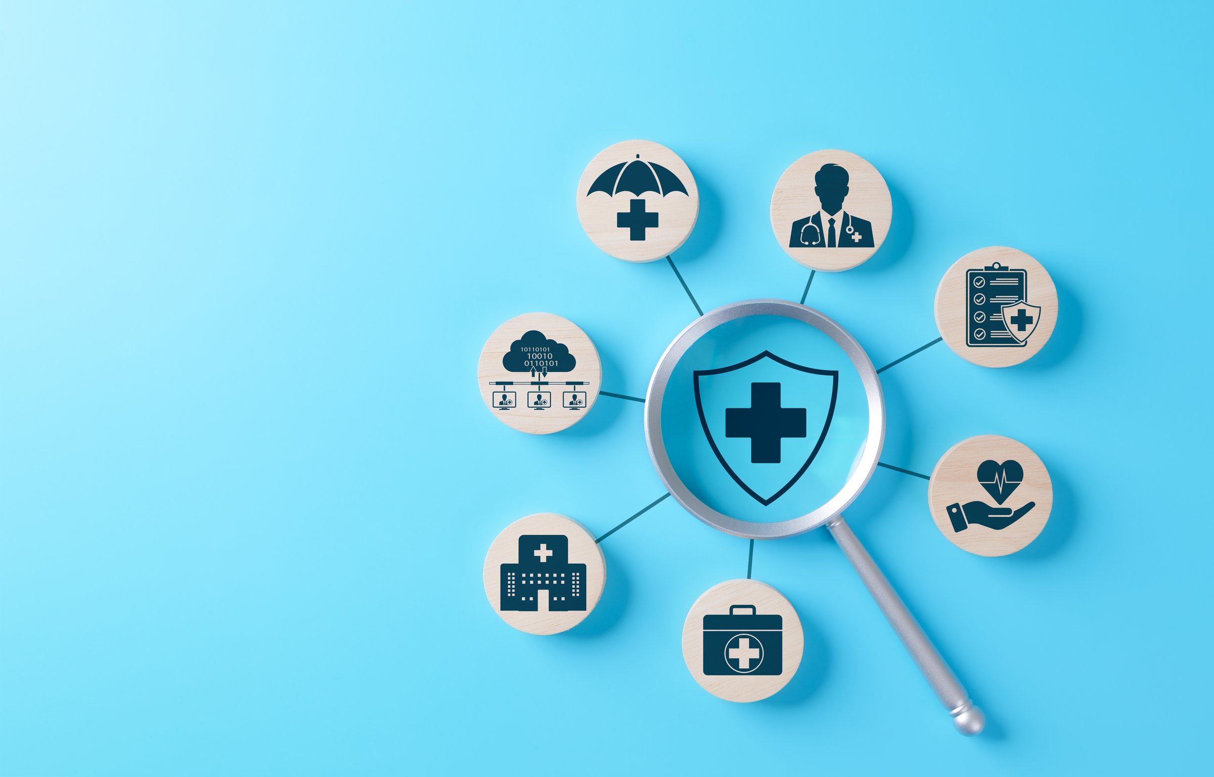 Health Insurance and Medical Care Concept. Magnifying glass focuses on shield featuring medical cross, surrounded by icons, medical care, health insurance, healthcare services, protection, coverage,