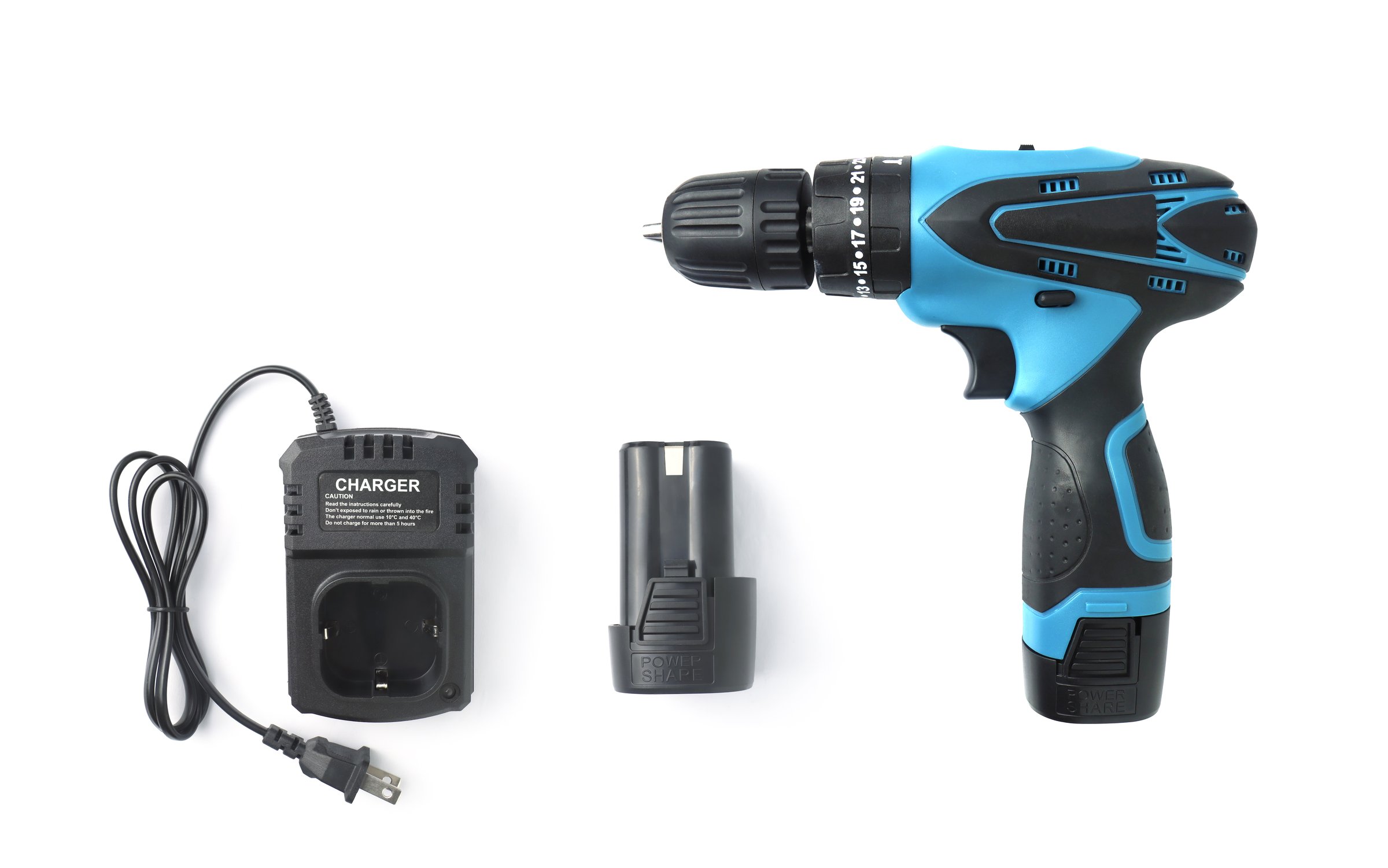 Modern cordless screwdriver or a blue cordless drill with charger and spare battery. Isolated on white background