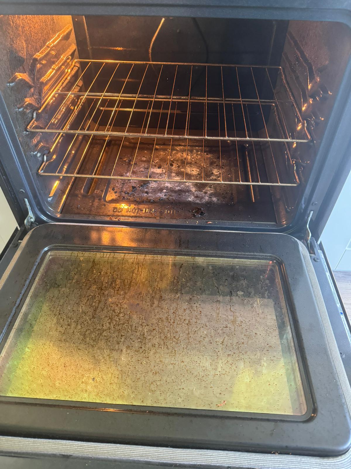 Interior oven cleaning before - dirty and greasy