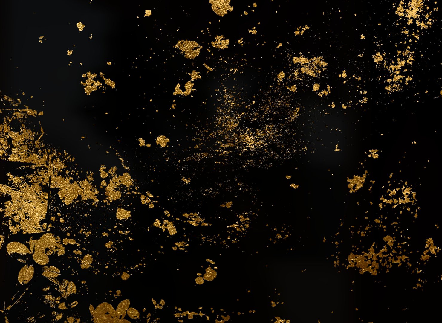 Abstract gold flakes scattered on a dark background creating a luxurious texture
