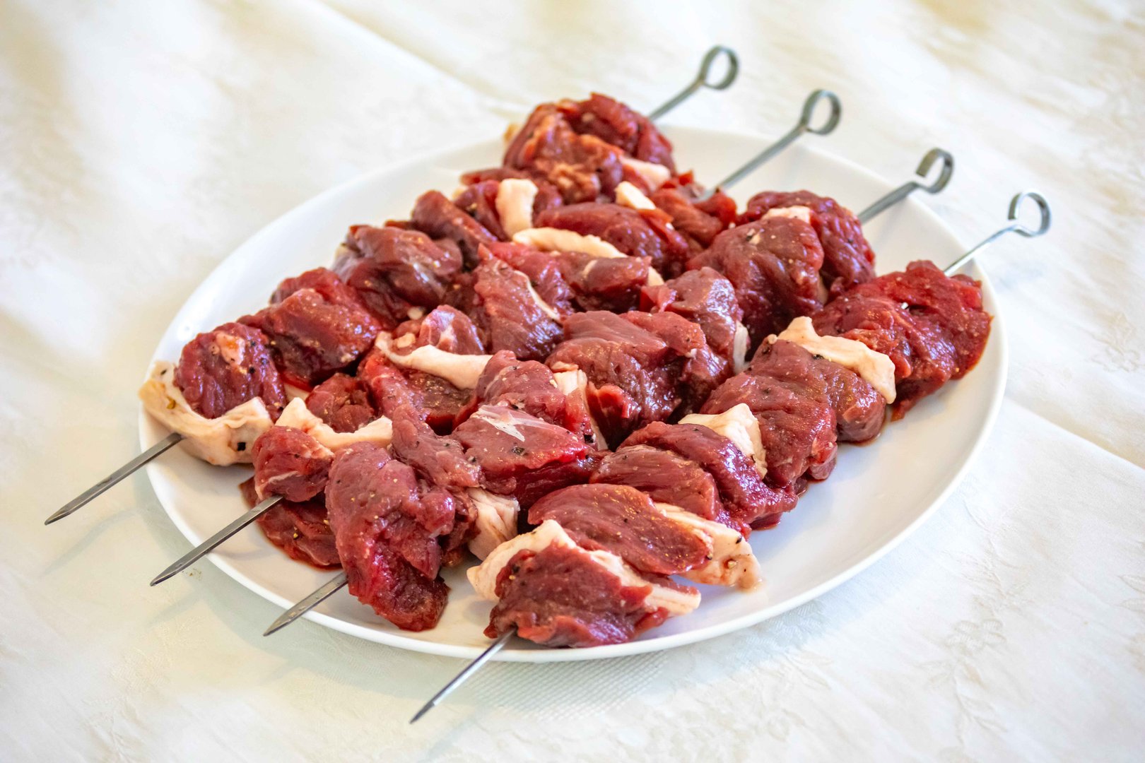 Typical Brazilian barbecue skewer made with filet mignon, a traditional happy hour snack. Espetinho, churrasquinho