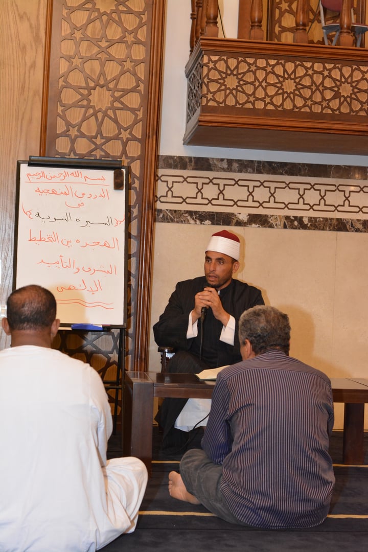 Cairo, Egypt, July 27 2022: A mosque Imam preacher gives a lecture on the prophetic biography and the prophet practices and Sunnah, an Islamic sermon after the prayer inside Al Masjid or the mosque