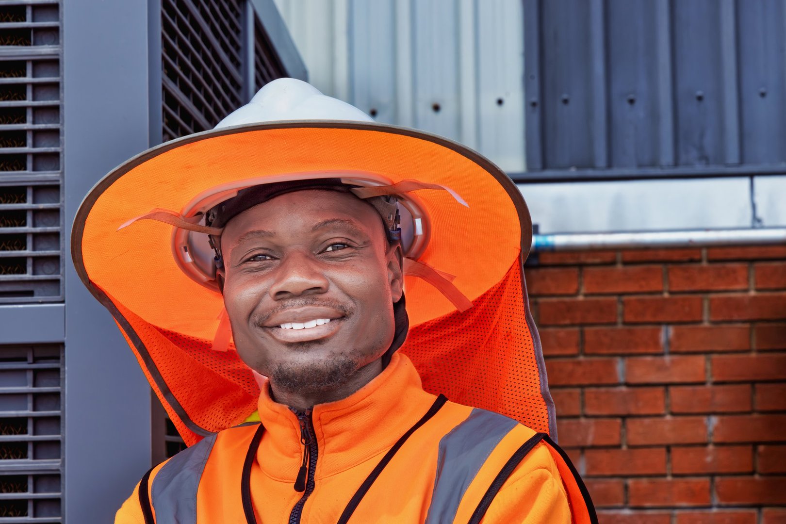 african american worker with orange protective equipment, Safety Hard Hat , Sunshield Hat for Sun with Neck Flap
