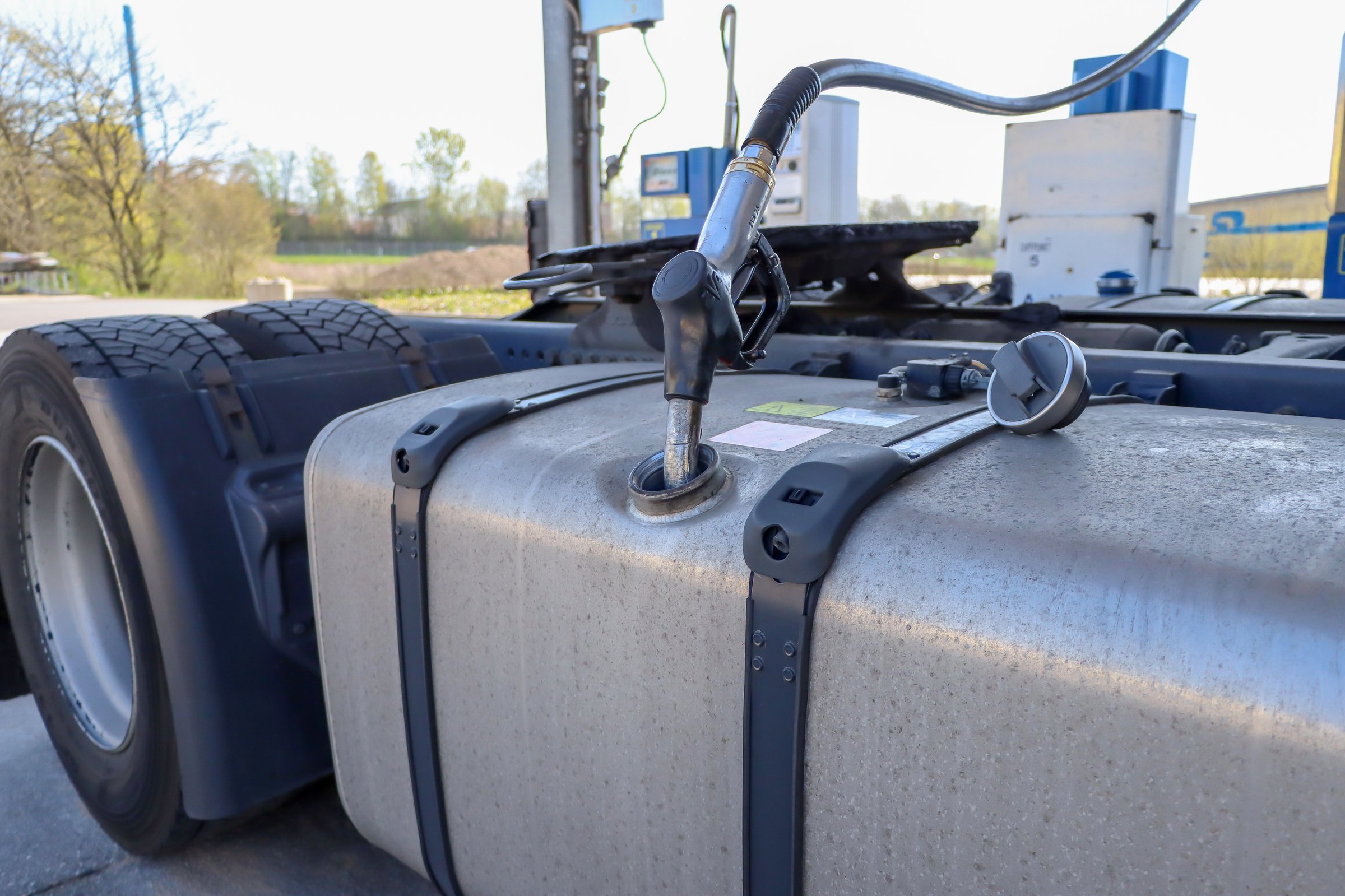 Refueling a truck with diesel fuel. Refueling nozzle in the tank of a truck. High quality photo