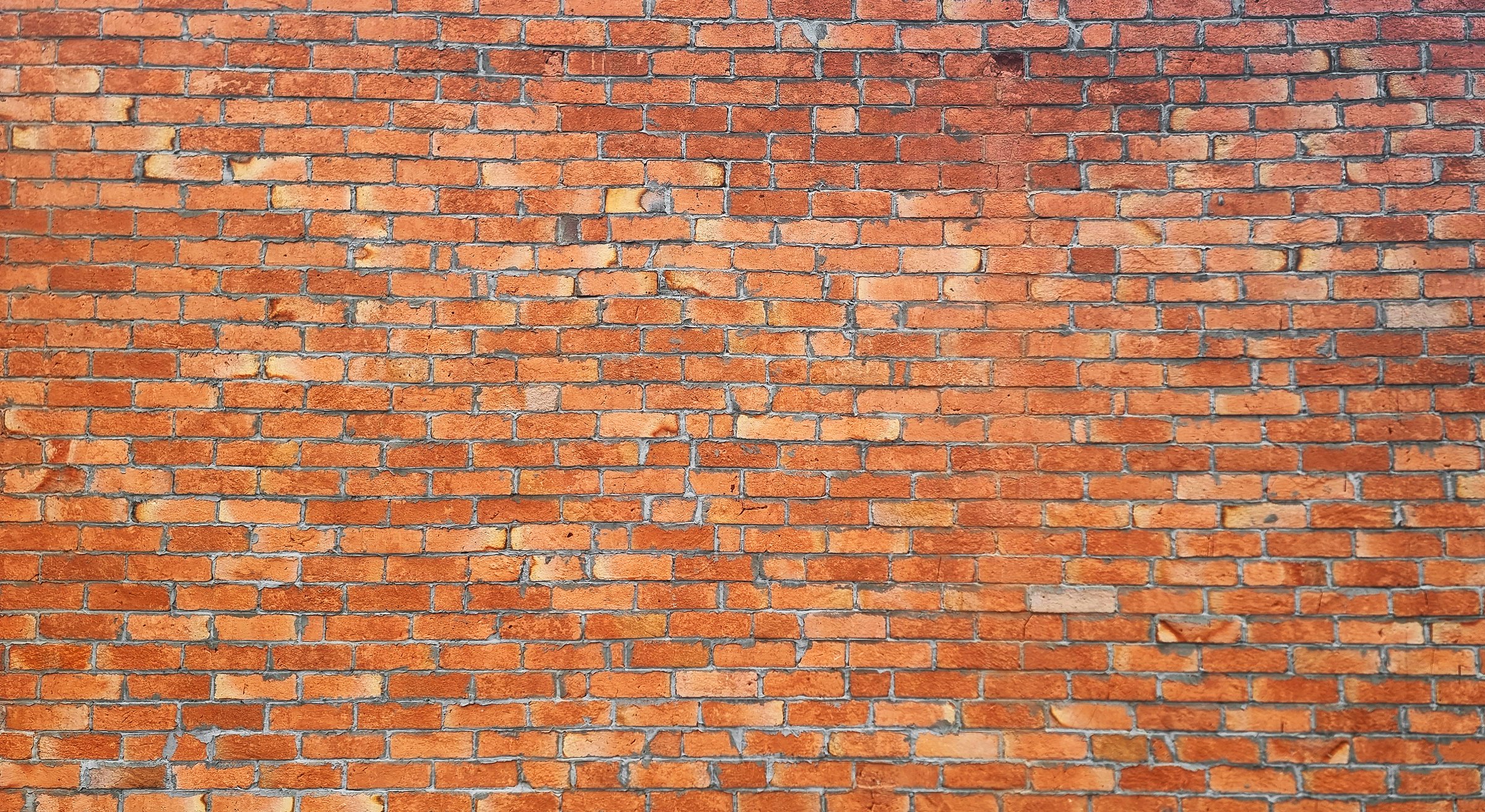 old brick wall of an old architecture building. brick wall texture. orange masonry of stone blocks use as background with blank space for design.