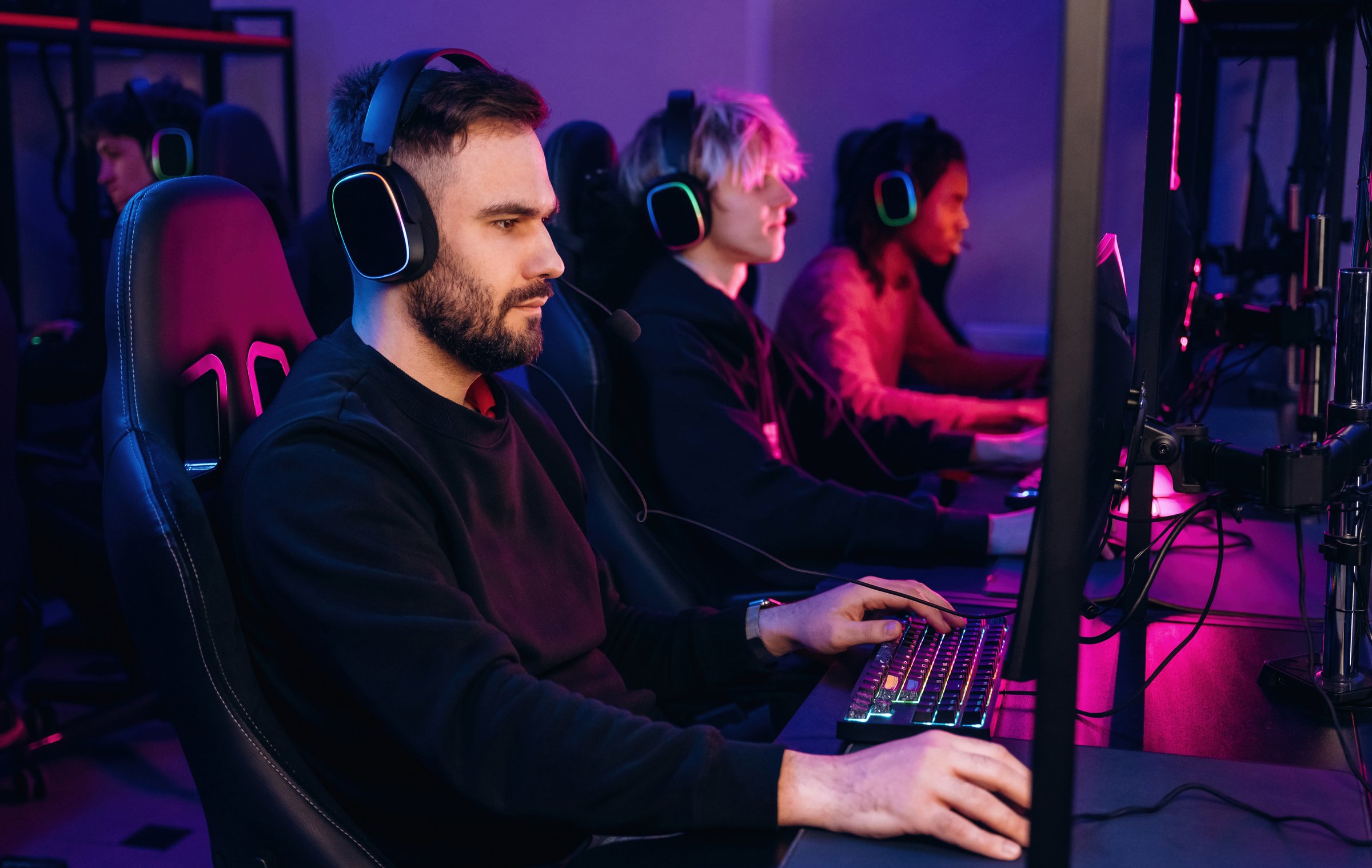 Competition conception. Gamers are playing video game by computers.
