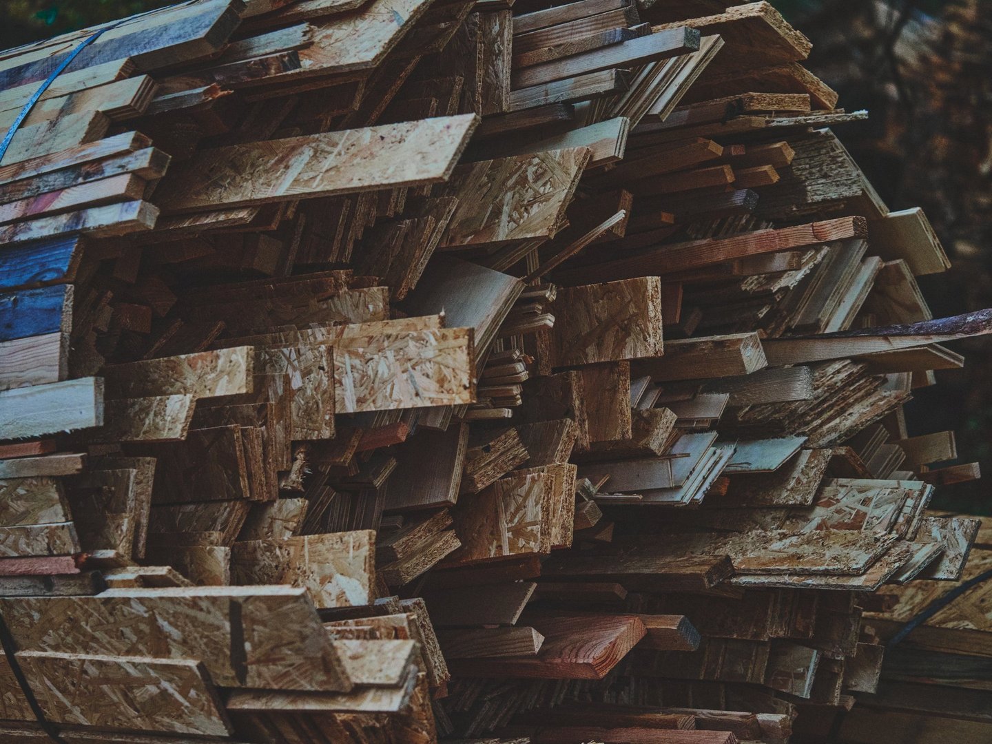 Warm matte composition of bundled wooden slats tied together, showcasing natural wood grain and craftsmanship texture.