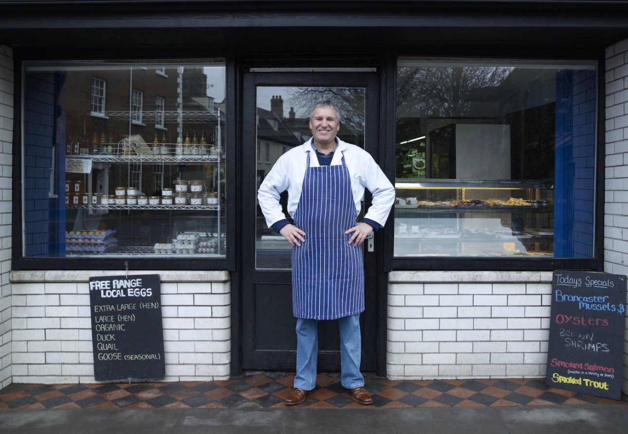 Local business owner at storefront