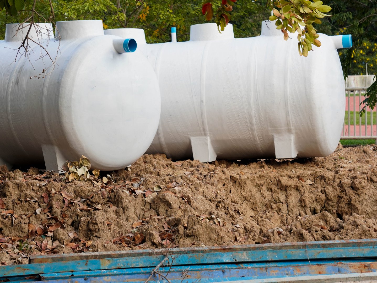 Plastic underground storage tanks for collecting rainwater. Septic tank in construction site.