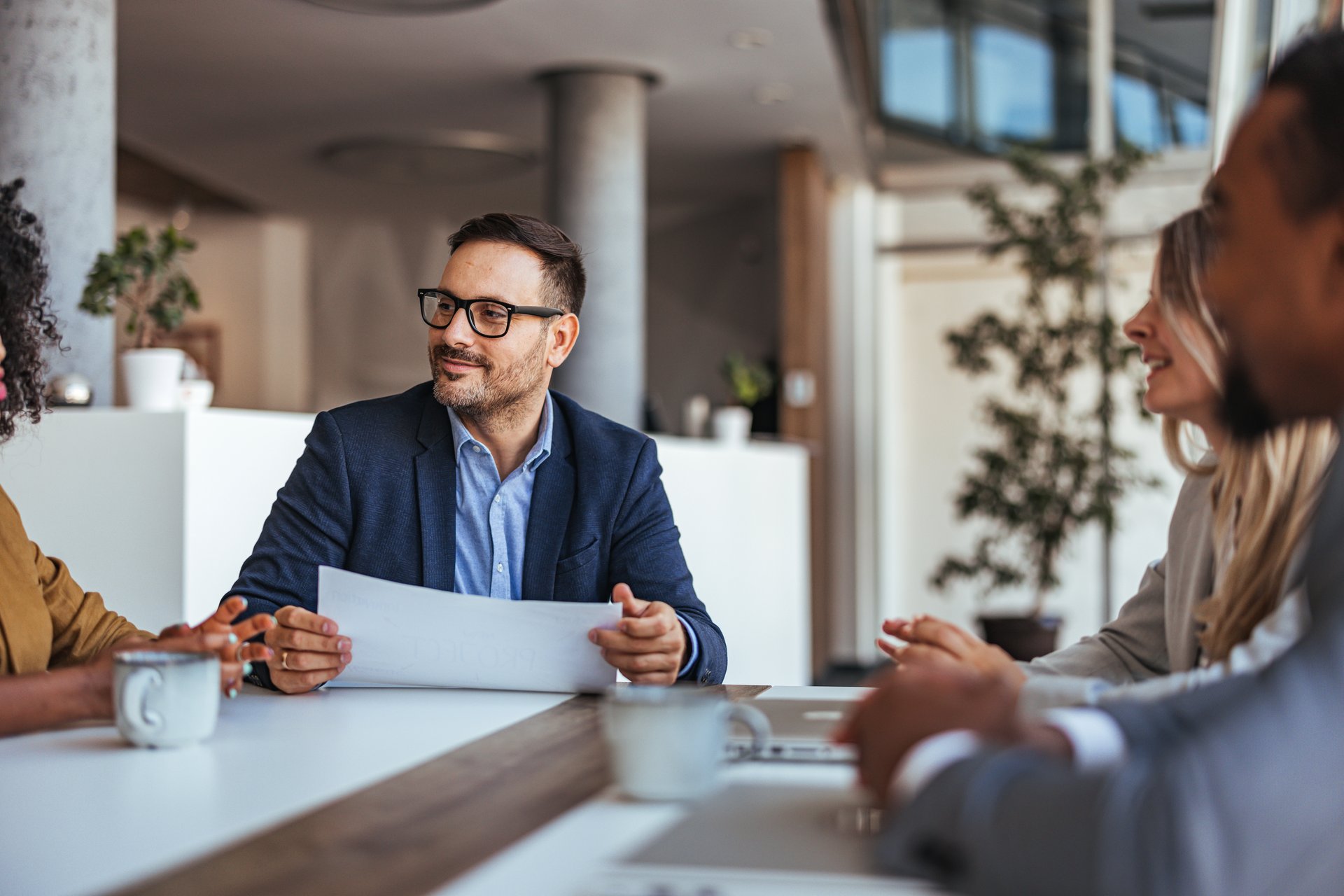 Meeting, documents and business people in office
