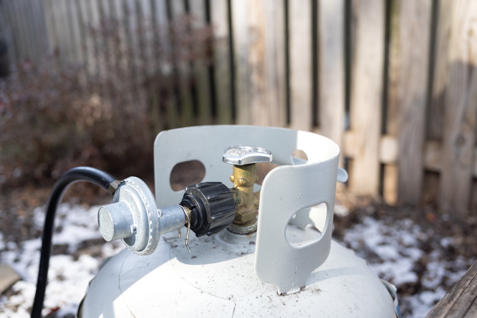 A backyard propane tank valve and hose connection