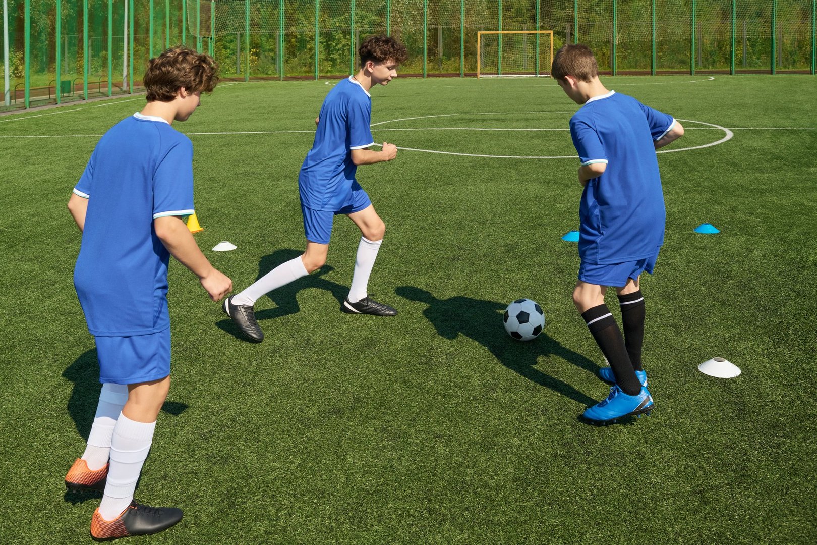Teenage boys playing soccer training