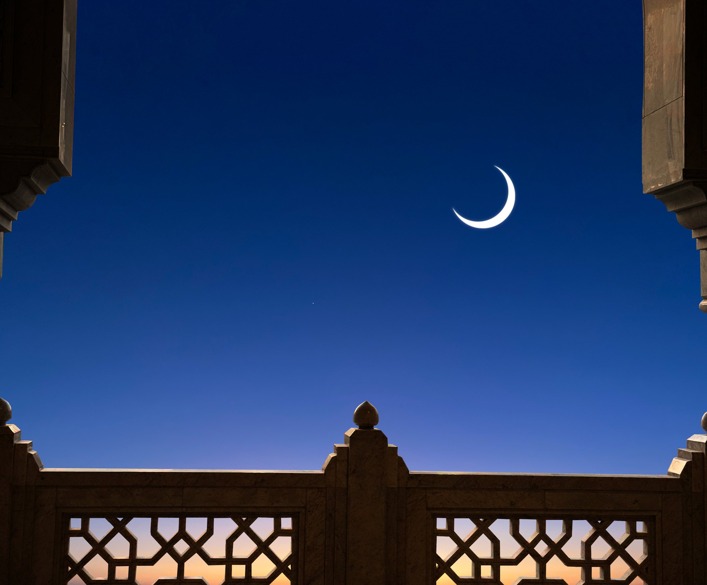 Ramadan or Eid Islamic night sunset with eastern crescent moon.
