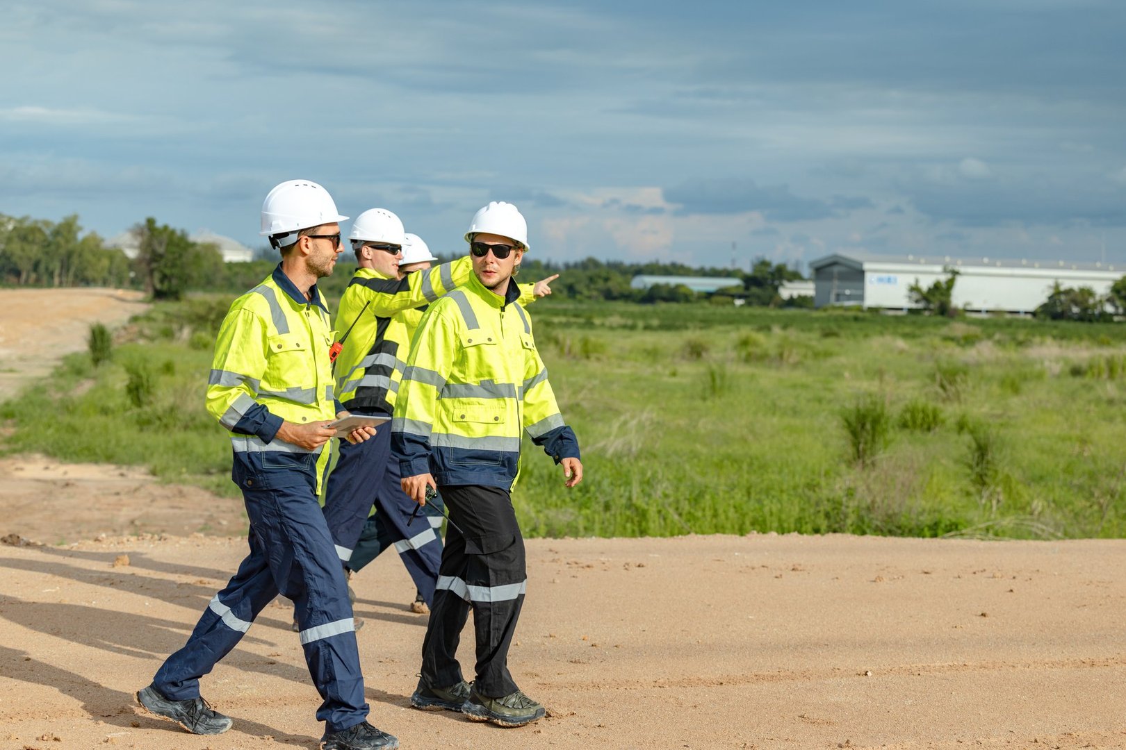 Engineer team project planning outdoor survey team, industry factory construction site. teamwork meeting . cooperation workers
