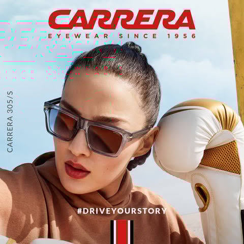 Woman wearing oversized Carrera sunglasses with a ponytail, holding a boxing glove, under the tagline "#DRIVEYOURSTORY."