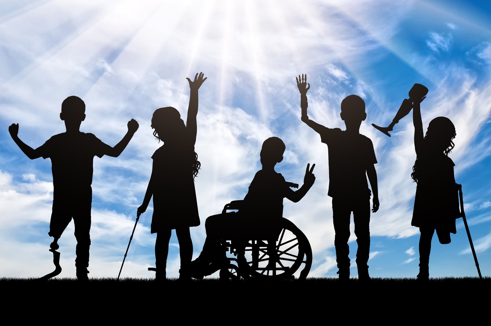 Silhouettes of five children with disabilities against a bright, sunny sky. Concept diversity and determination of children overcoming physical challenges, making it a powerful representation of inclusion and hope