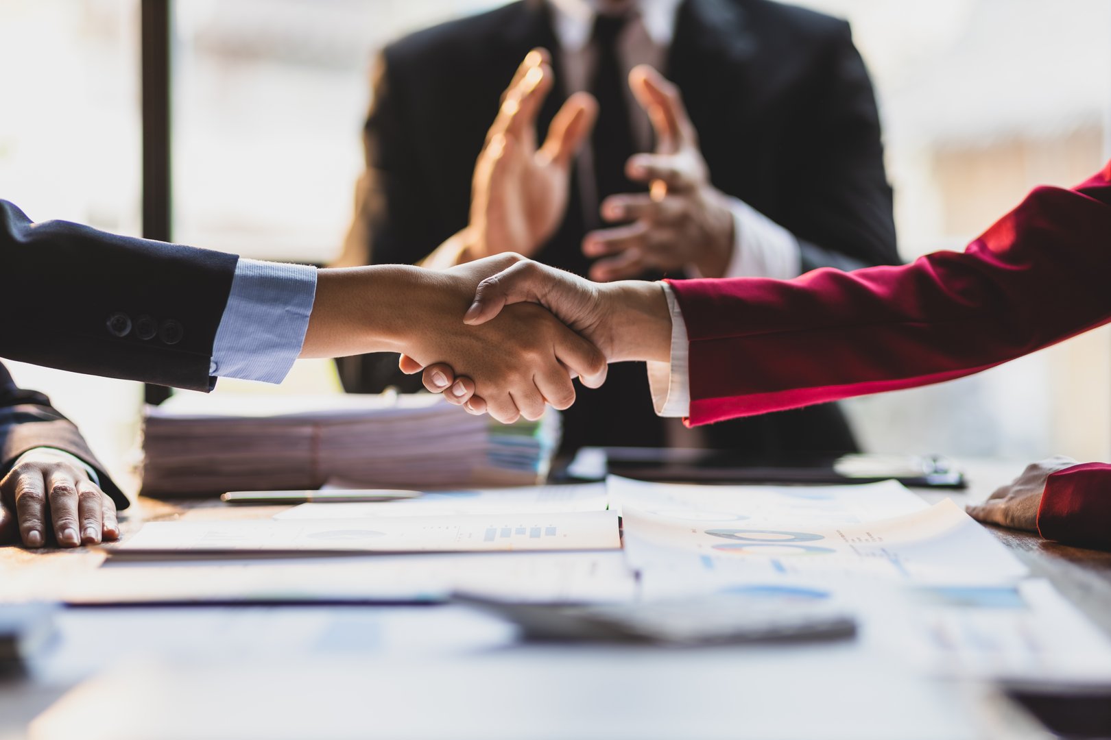 Handshake, Business cooperation at a meeting of business people. Business partners shaking hands in a meeting.