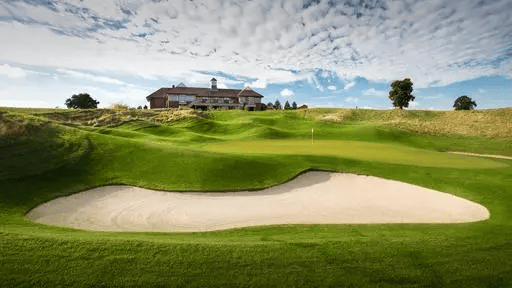 The Oxfordshire Golf Hotel clubhouse and bunker autumn championship course