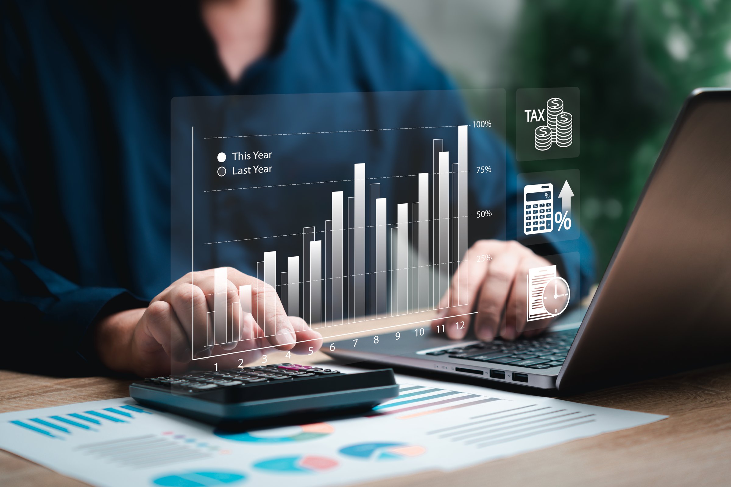 Business analysis cost comparison, Taxes payment, Businessman use Laptop and calculator for bookkeeping payroll and budget tax, Growth with financial graph, document finance accounting investment