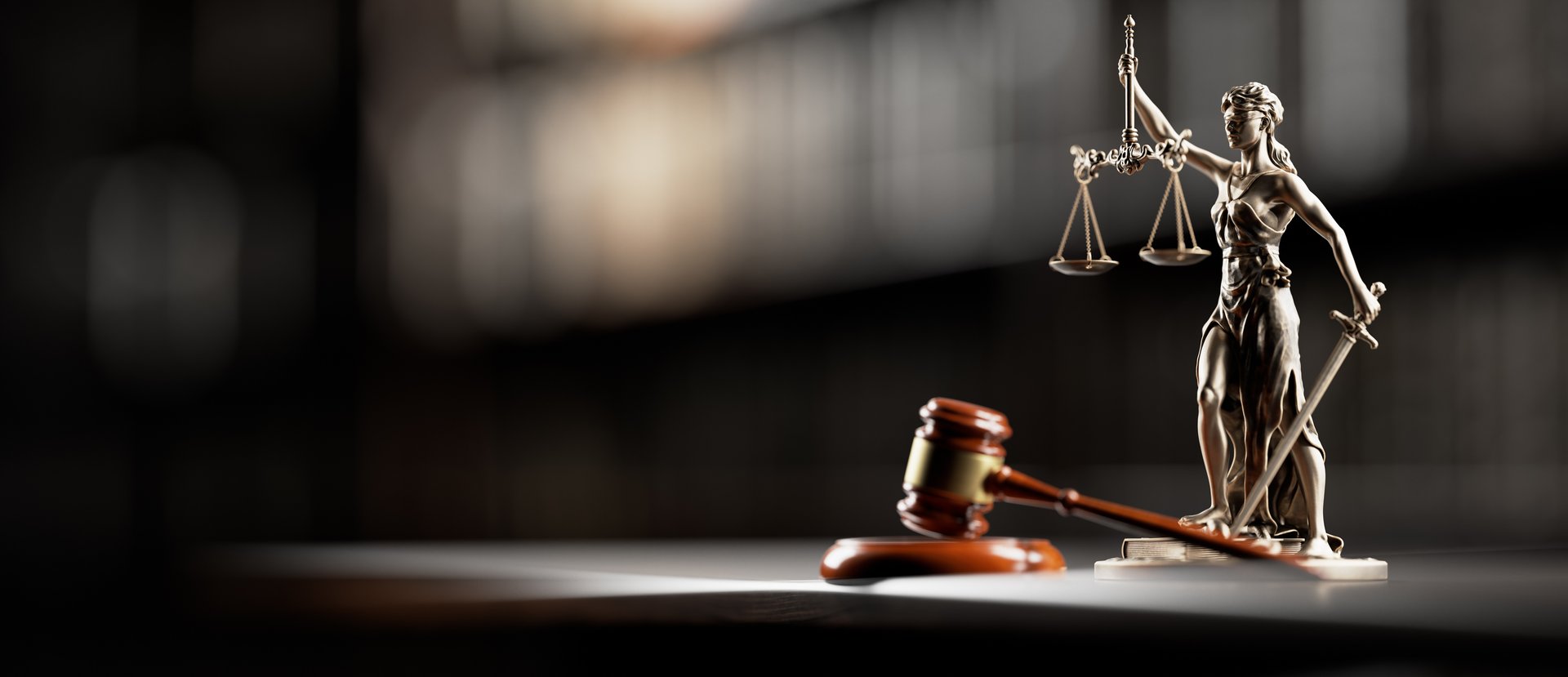 Legal Concept: Themis is the goddess of justice and the judge's gavel hammer as a symbol of law and order on the background of books.
