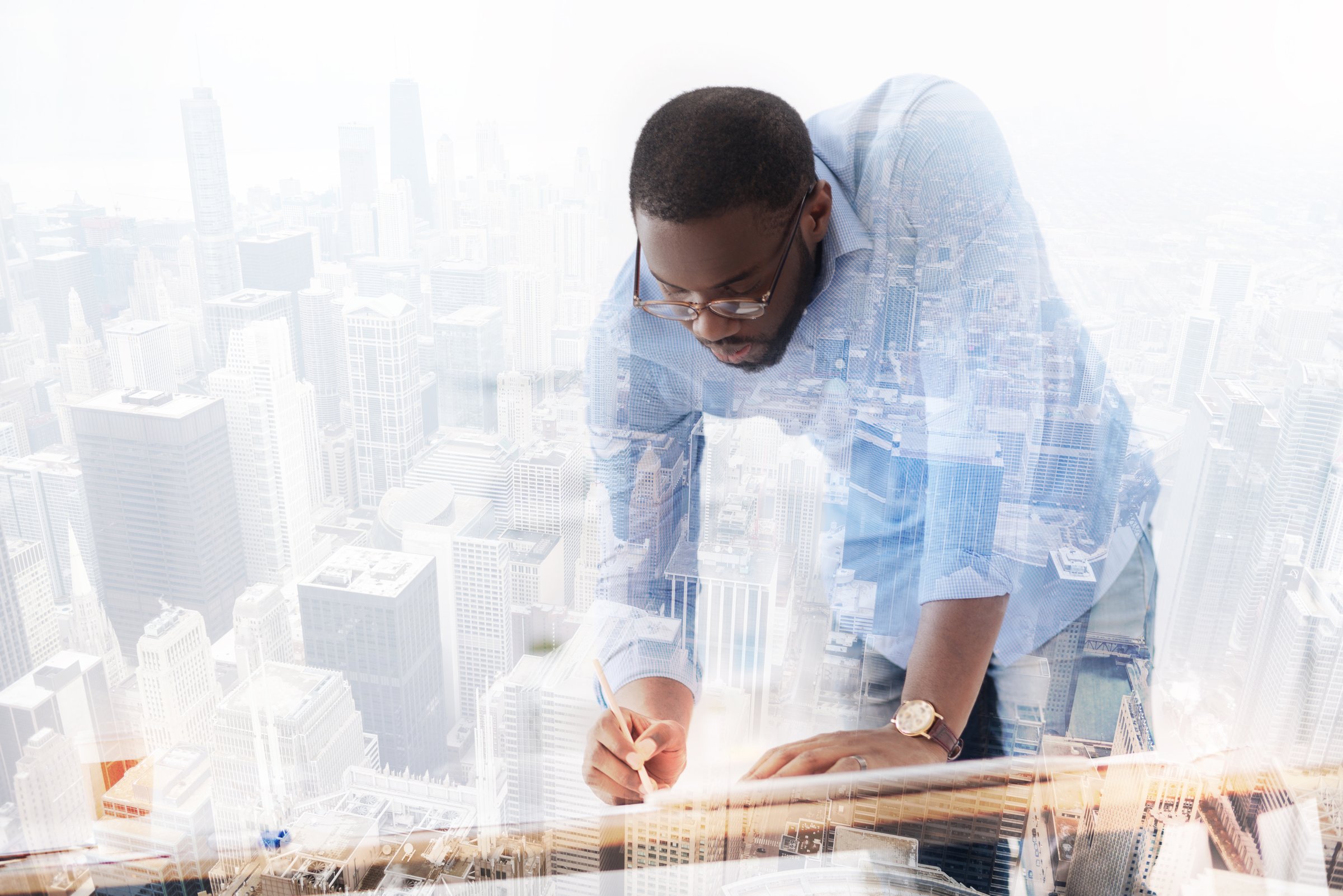 Smart approach. Attentive young African American working on new project while standing completely involved in the process