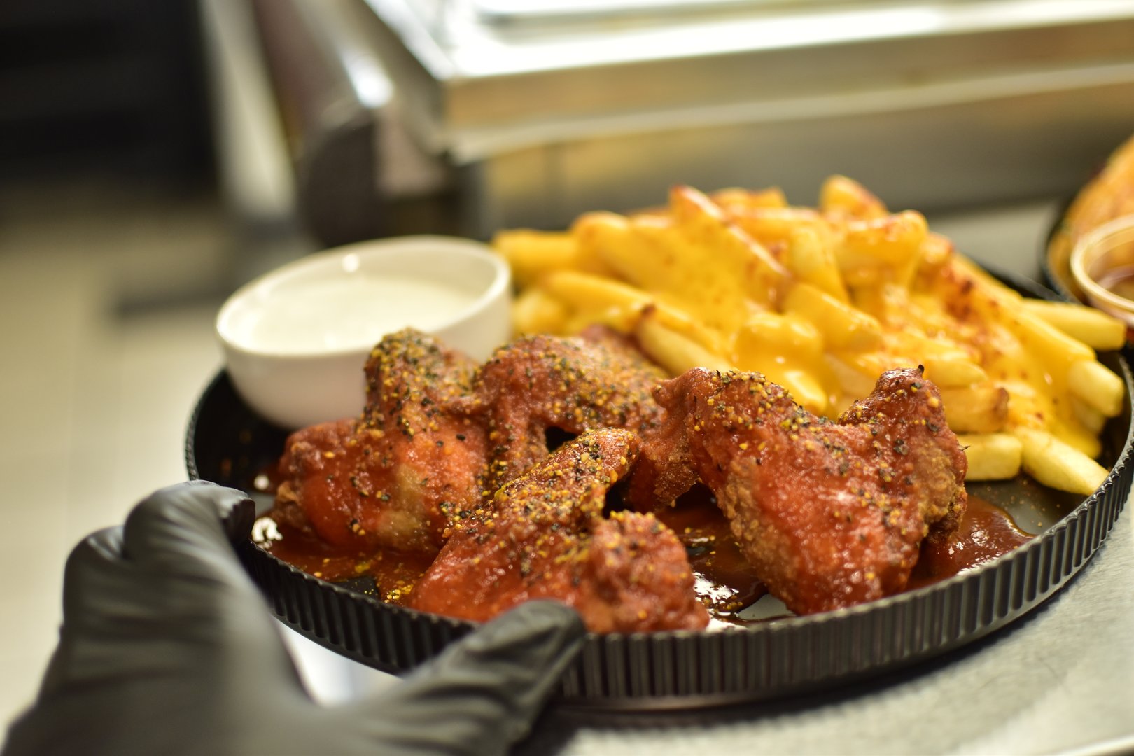 Hot lemon pepper whole wings with cajun ranch fries