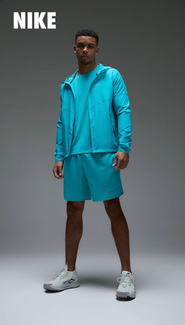 Athletic model showcasing Nike tracksuit in professional sportswear fashion campaign