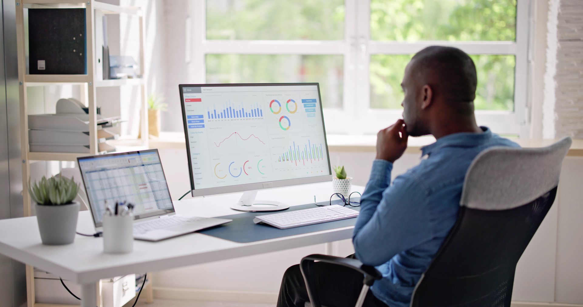 African Businessman Using Analytics Data KPI Dashboard Tech