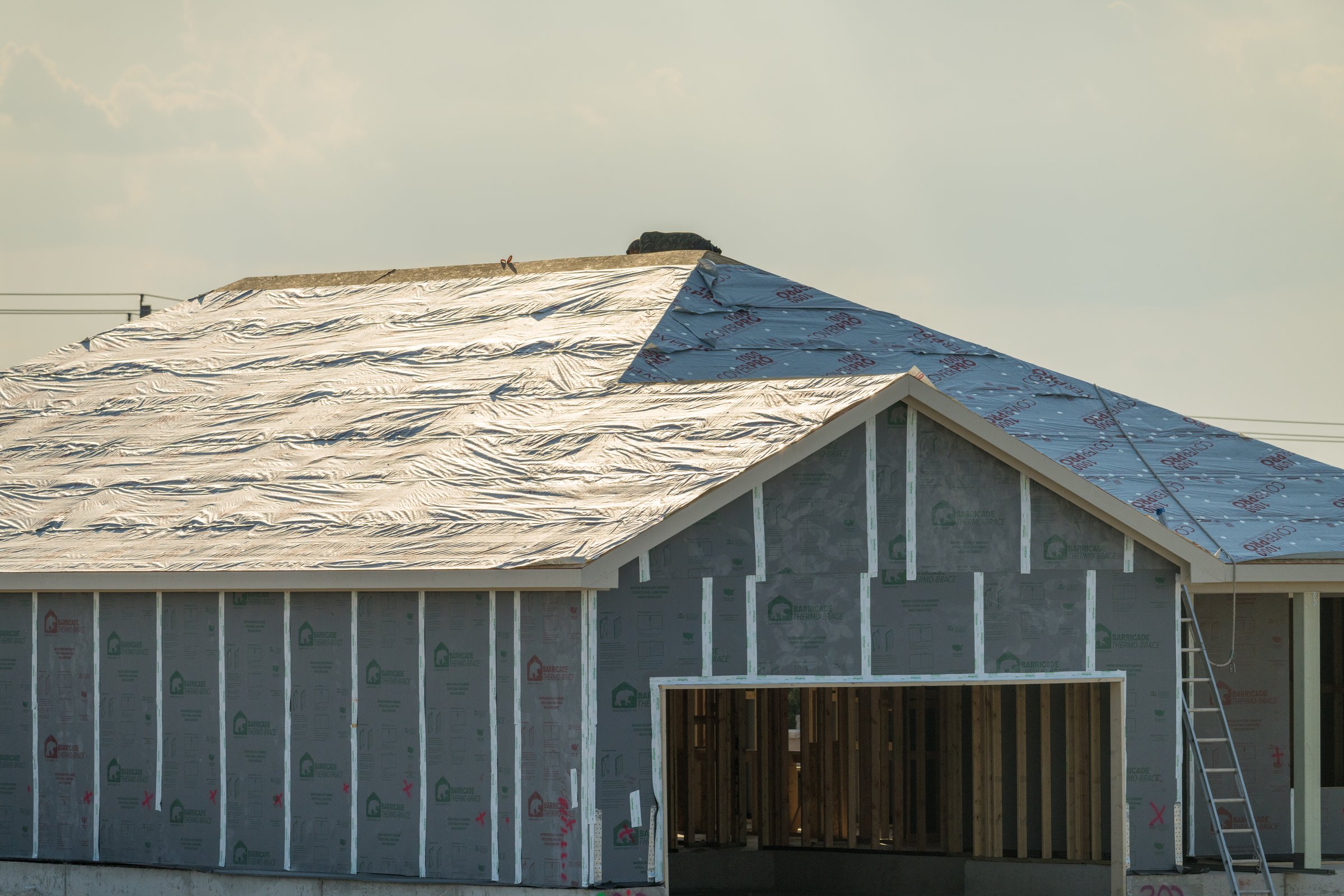 House with synthetic roofing underlayment