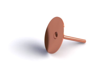 Copper-colored circular disc with a pin attached, placed on a white surface and casting a subtle shadow.