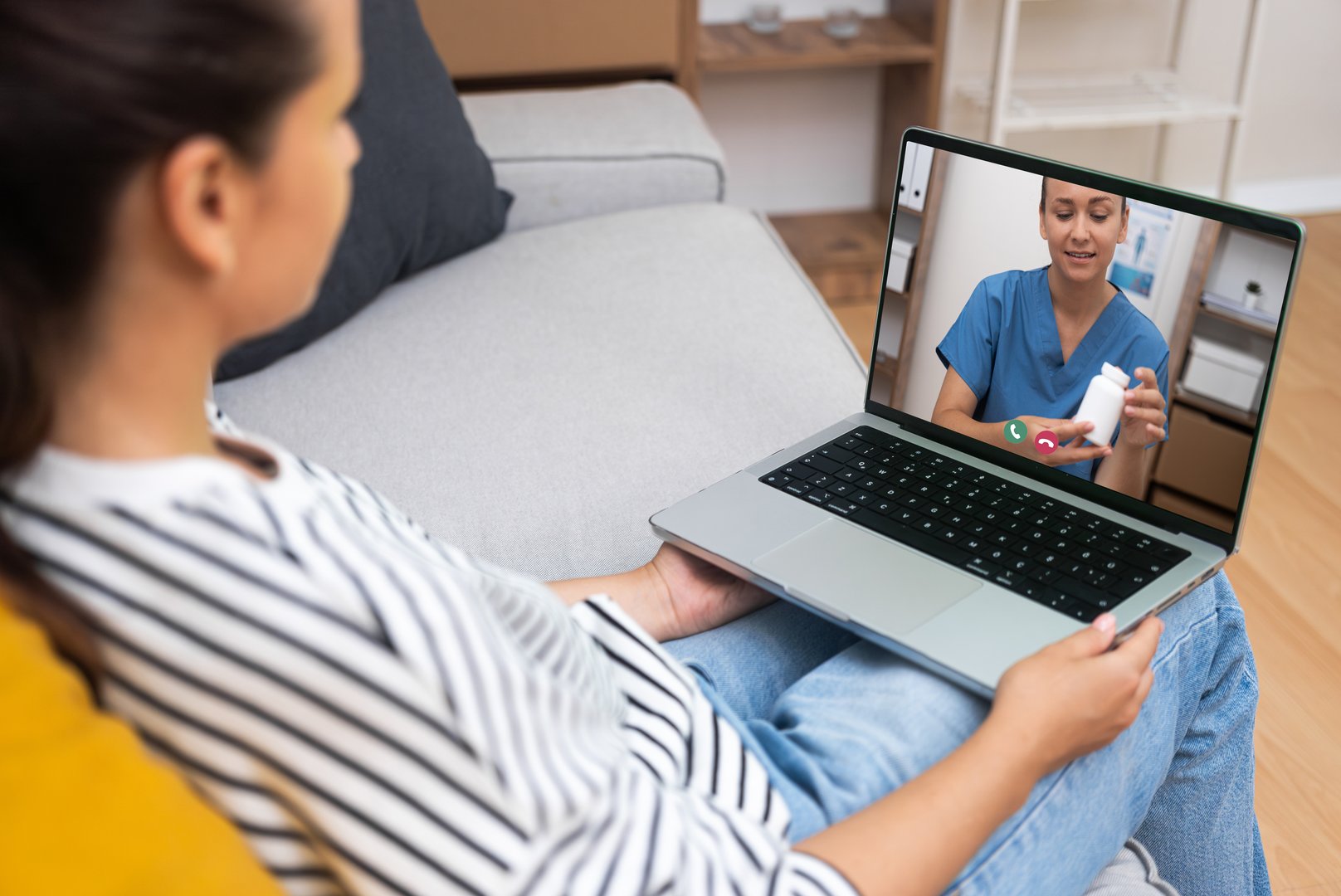 Female doctor demonstrating medication to a patient over a video call, exemplifying modern telemedicine practices.