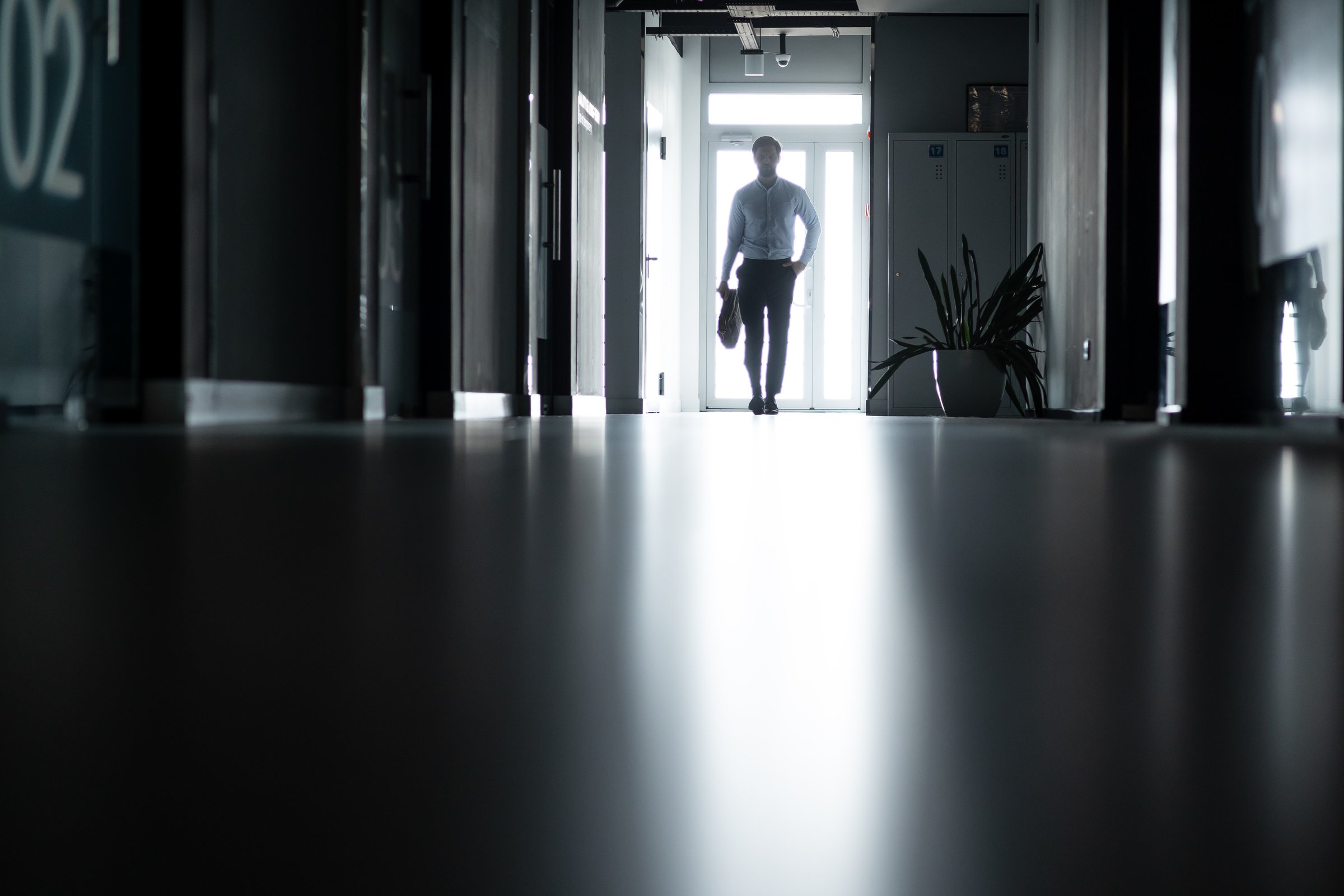 Businessman walking towards light