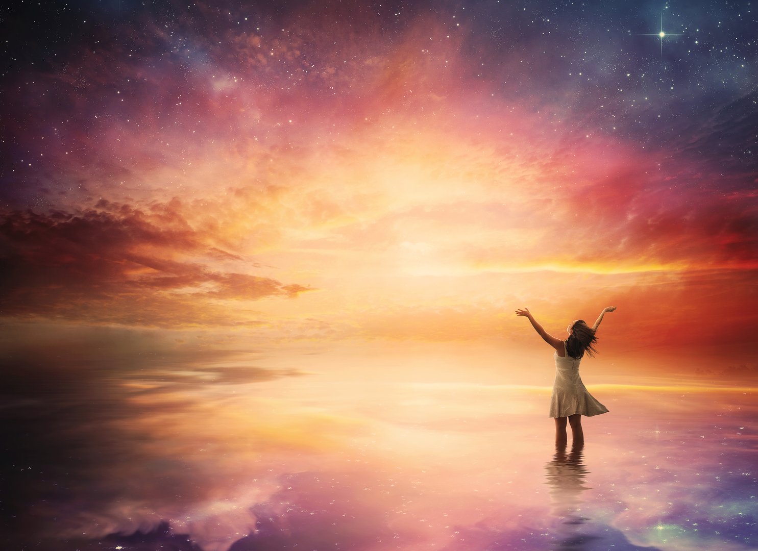 Woman stands in praise before a beautiful night sky.