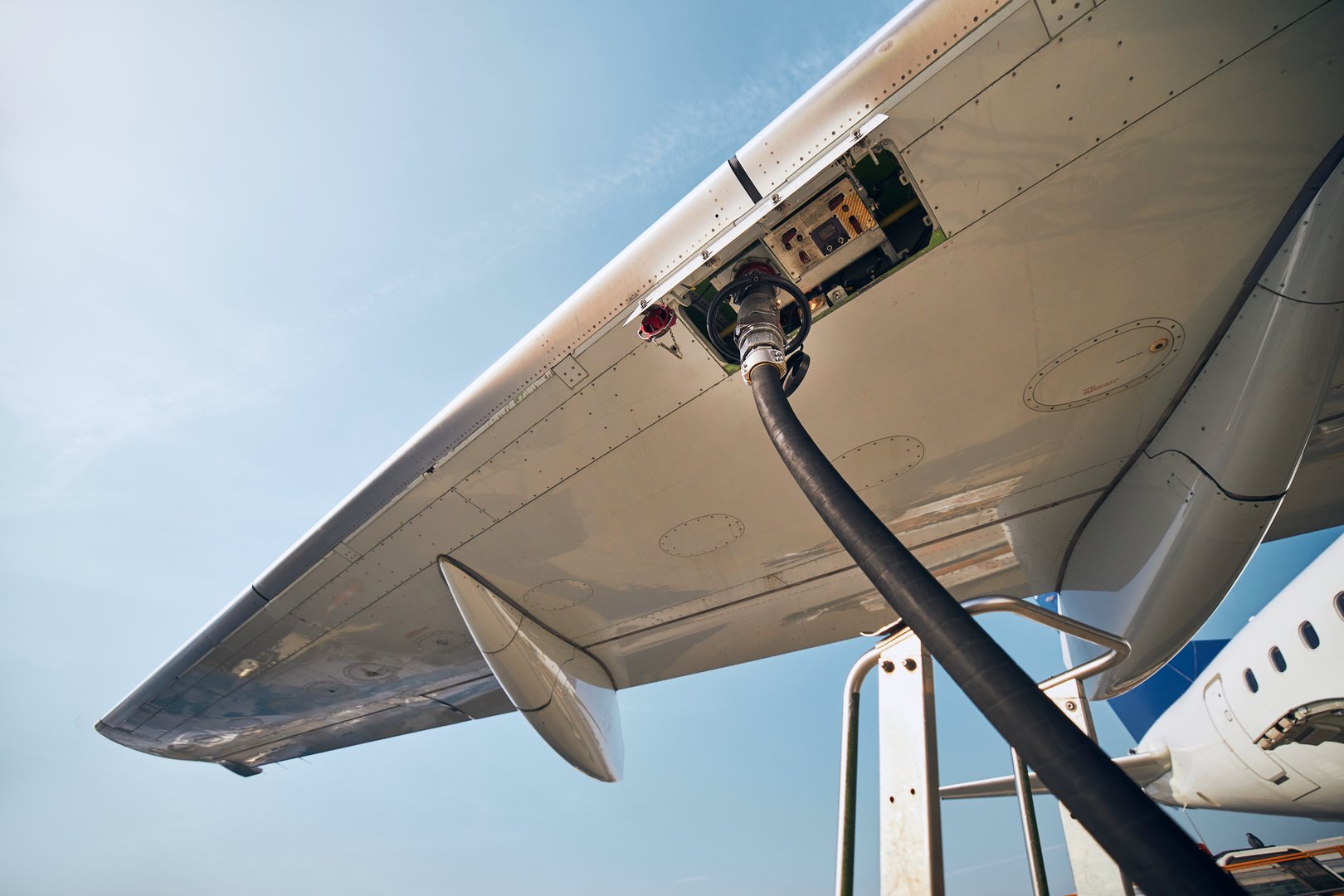 Ground service before flight. Refueling of airplane at airport.