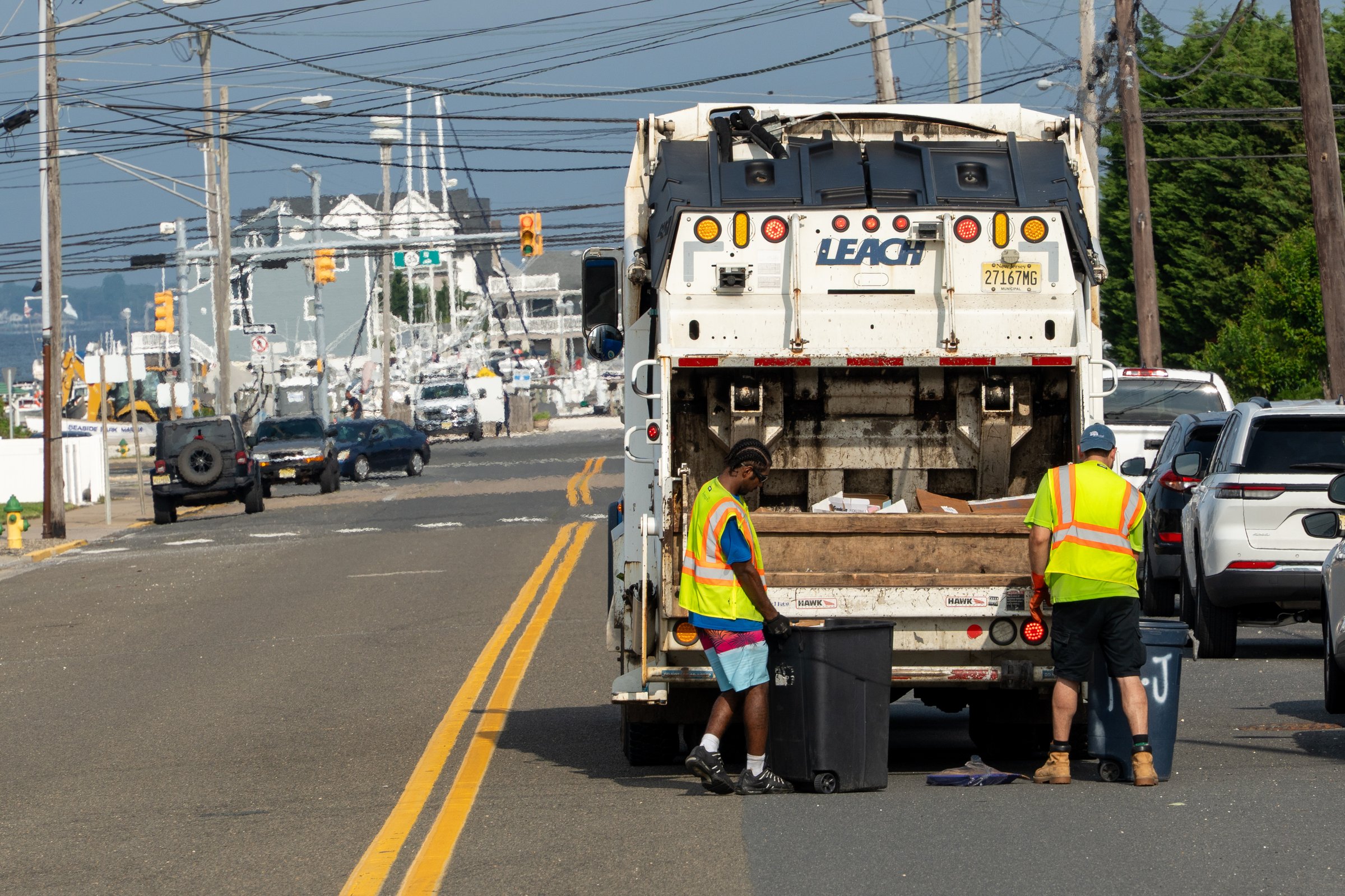 Seaside Park, NJ - USA - July 9 2025 - Sanitation workers collect garbage from residents in the morning