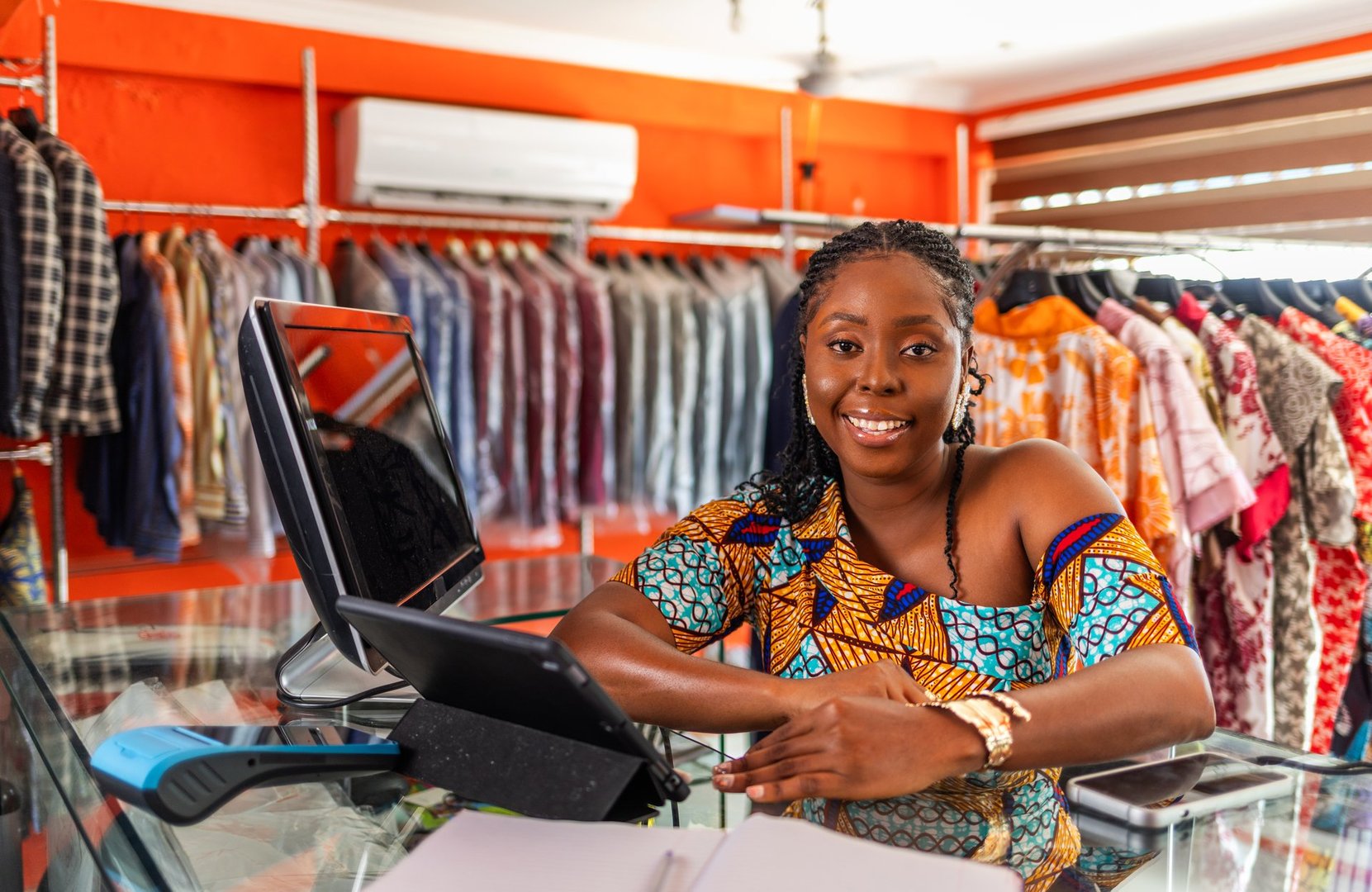 African American woman business owner in her boutique store