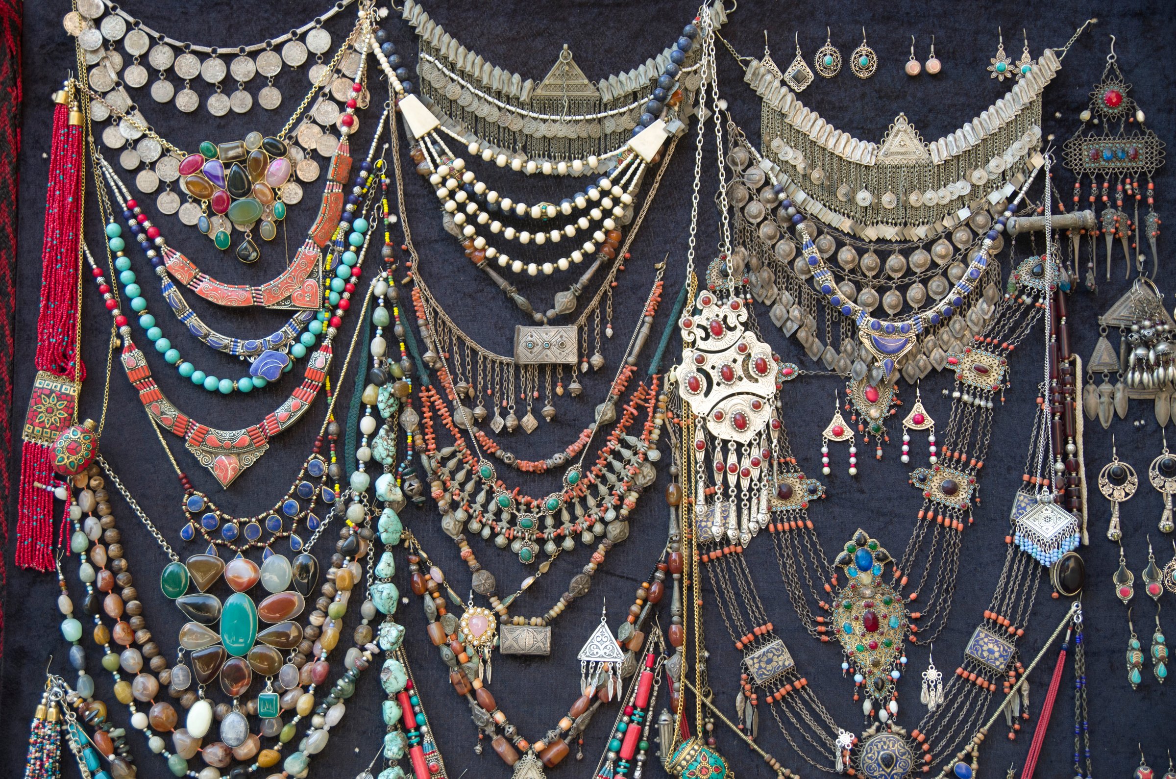 Colorful Women's jewelry - earrings and necklaces in bazaar in Uzbekistan, Asia