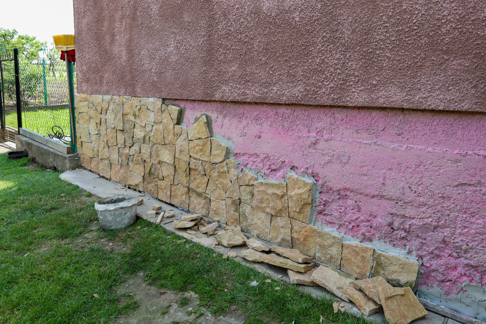 Facade decoration work on a house with decorative stone