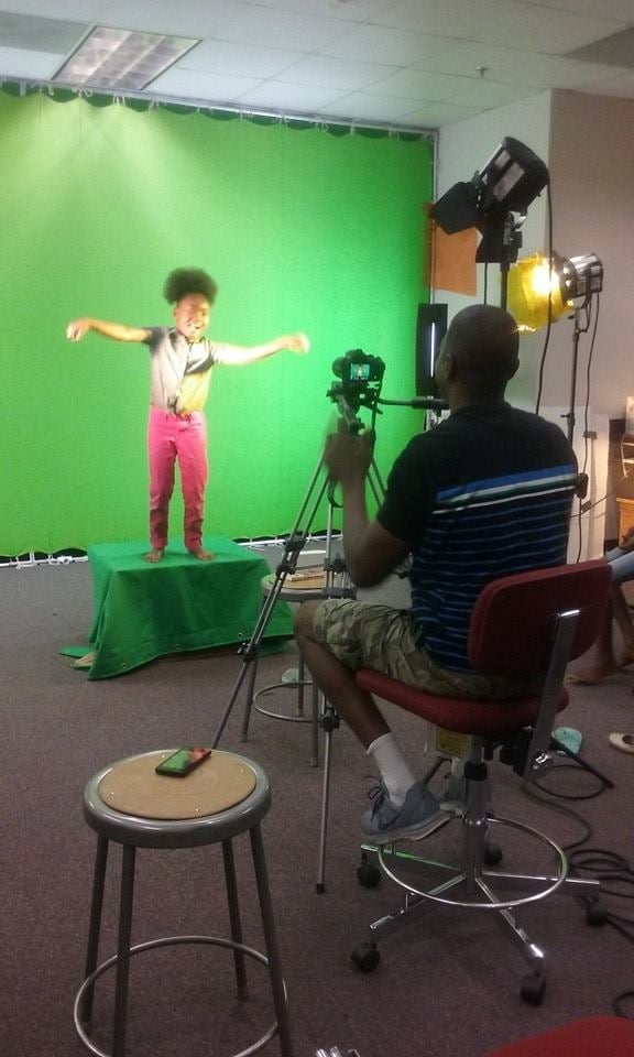 videographer close up, cameraman, man with camera, movie,"n
