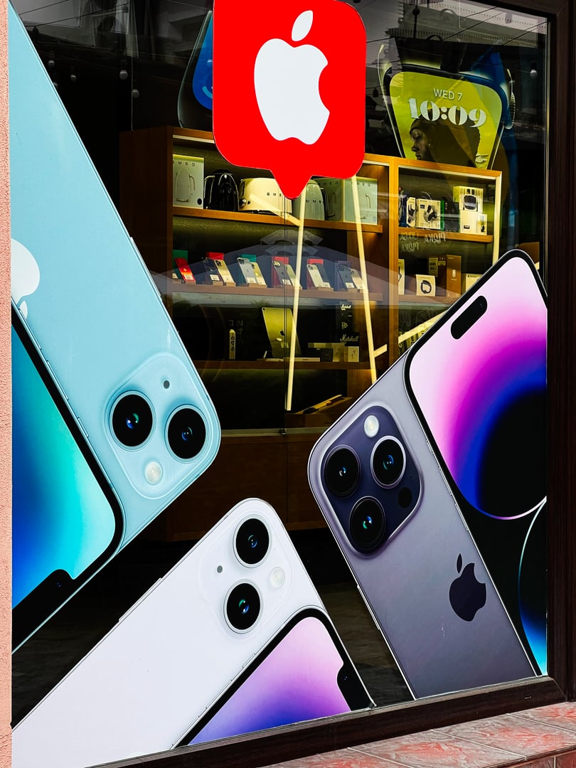 Kyiv, Ukraine - May 14, 2025: Close-up view of Apple Iphone smartphone graphics on storefront with sleek and vibrant designs